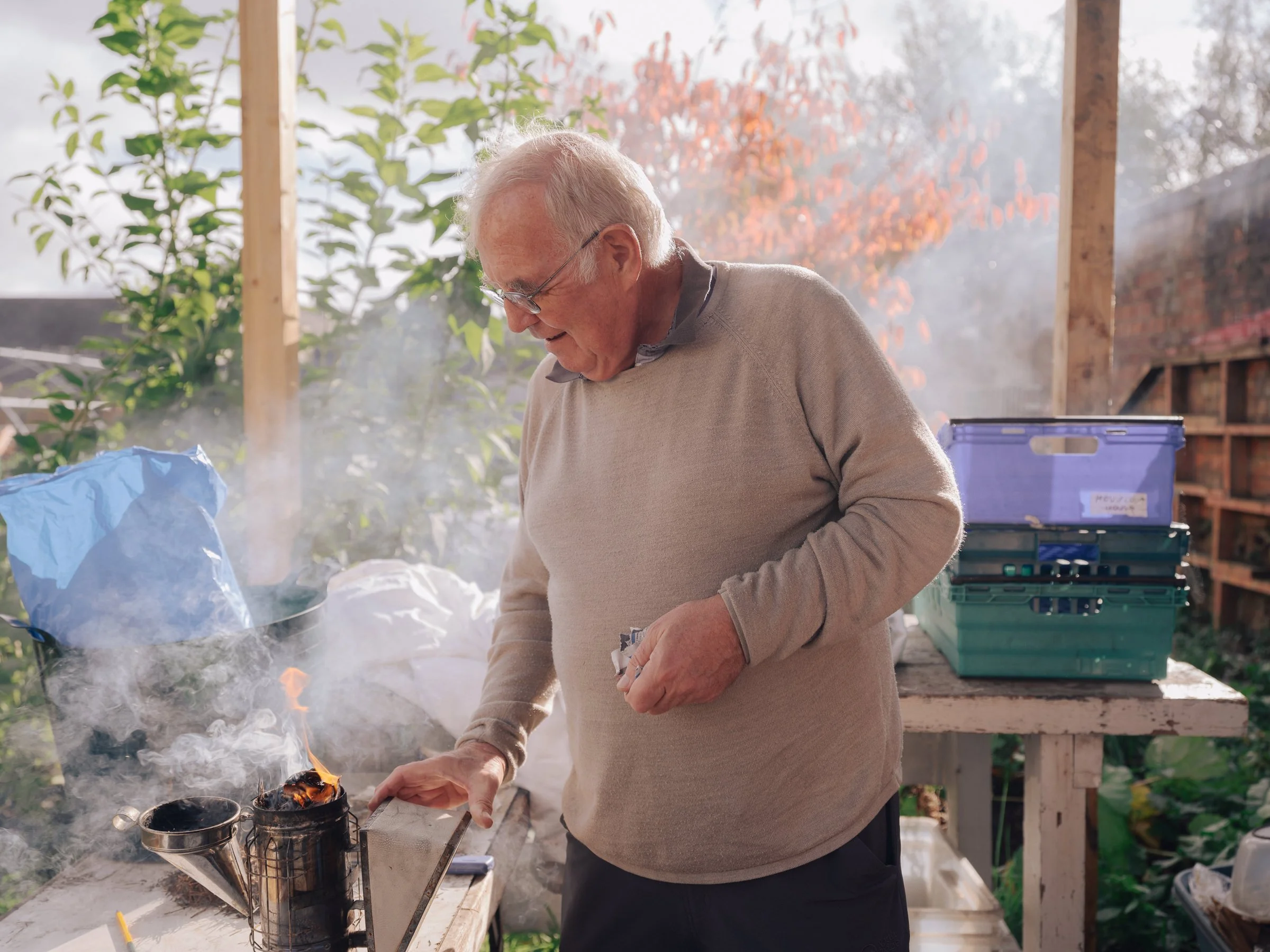 Beekeeper Danny McGee makes a smoker to calm bees.