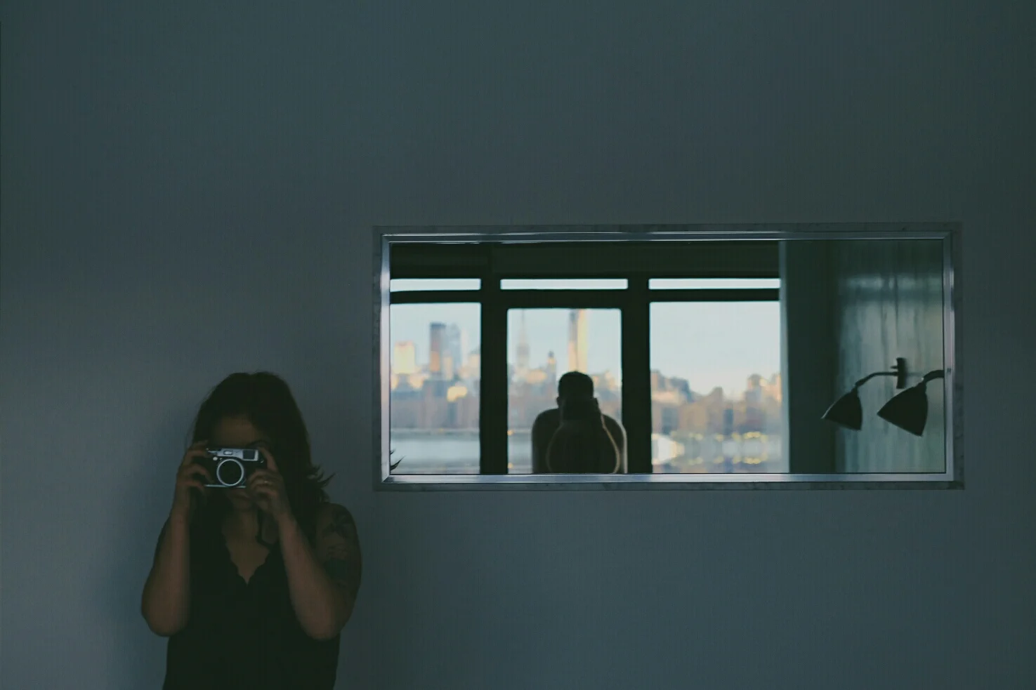 This is my wife, Cat. She's decided that she wants to learn photography beyond her iPhone. She has a camera of mine for the trip. Hopefully you never see the other side of this photo inception. 