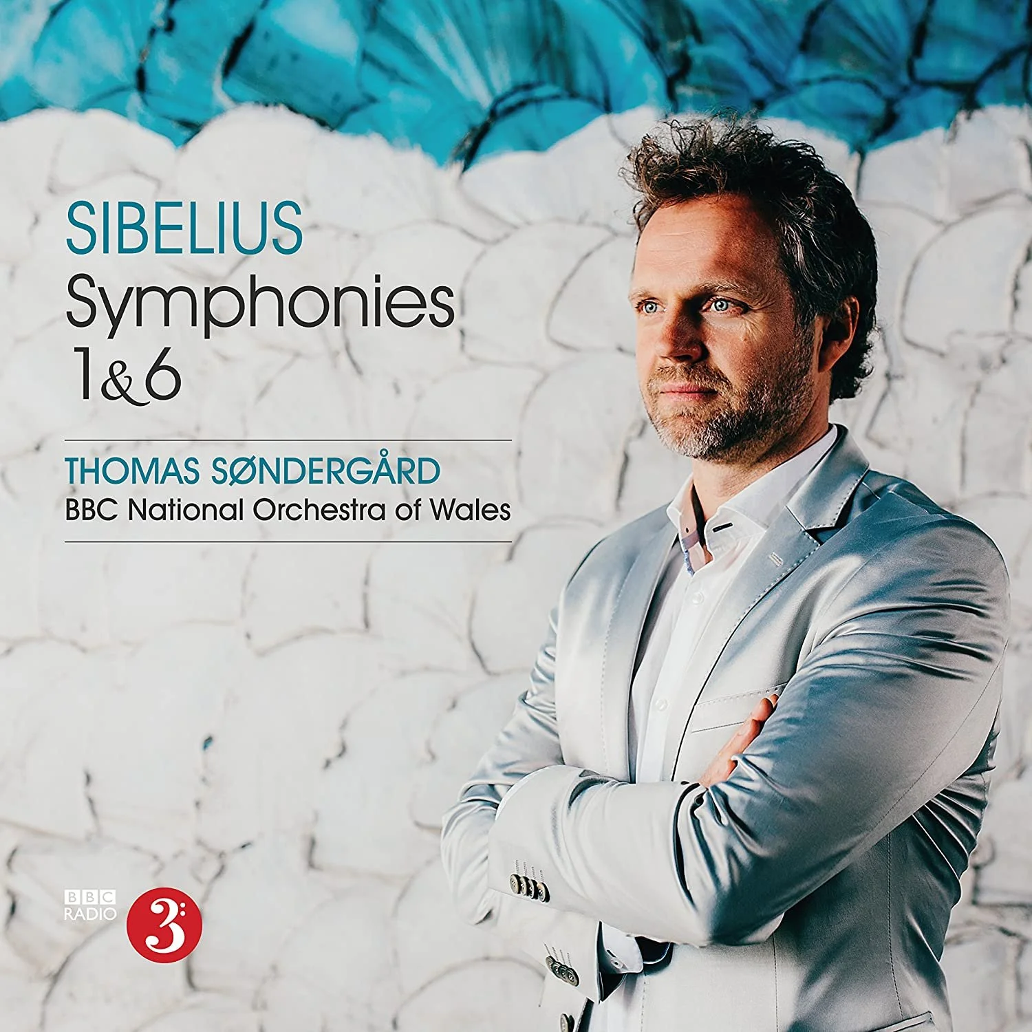 Promotional poster for Sibelius Symphonies 1 & 6 featuring conductor Thomas Søndergård of the BBC National Orchestra of Wales, with a portrait of him in a silver suit standing with arms crossed in front of a textured white and blue wall.