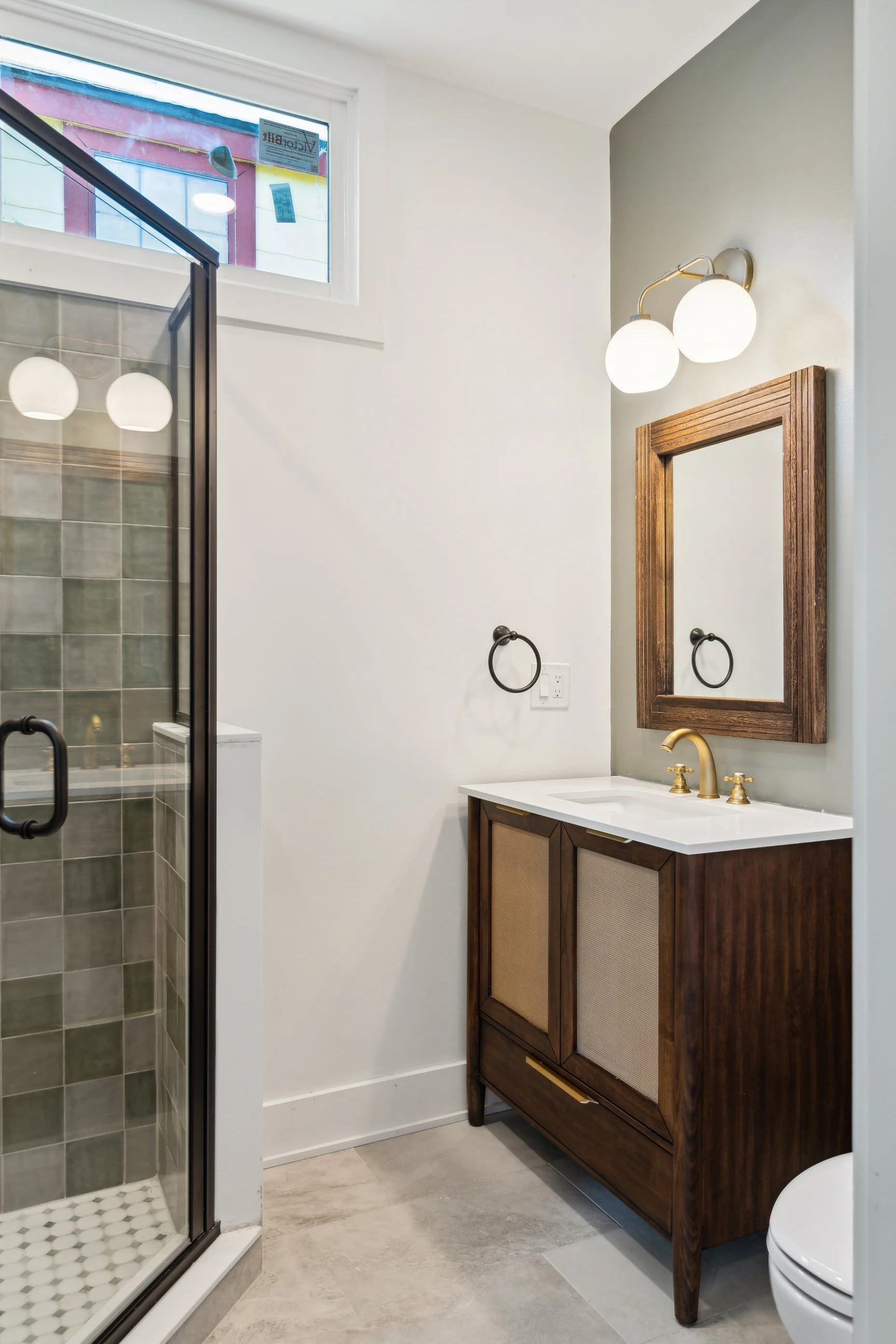 bathroom remodel with walk in shower and wooden vanity