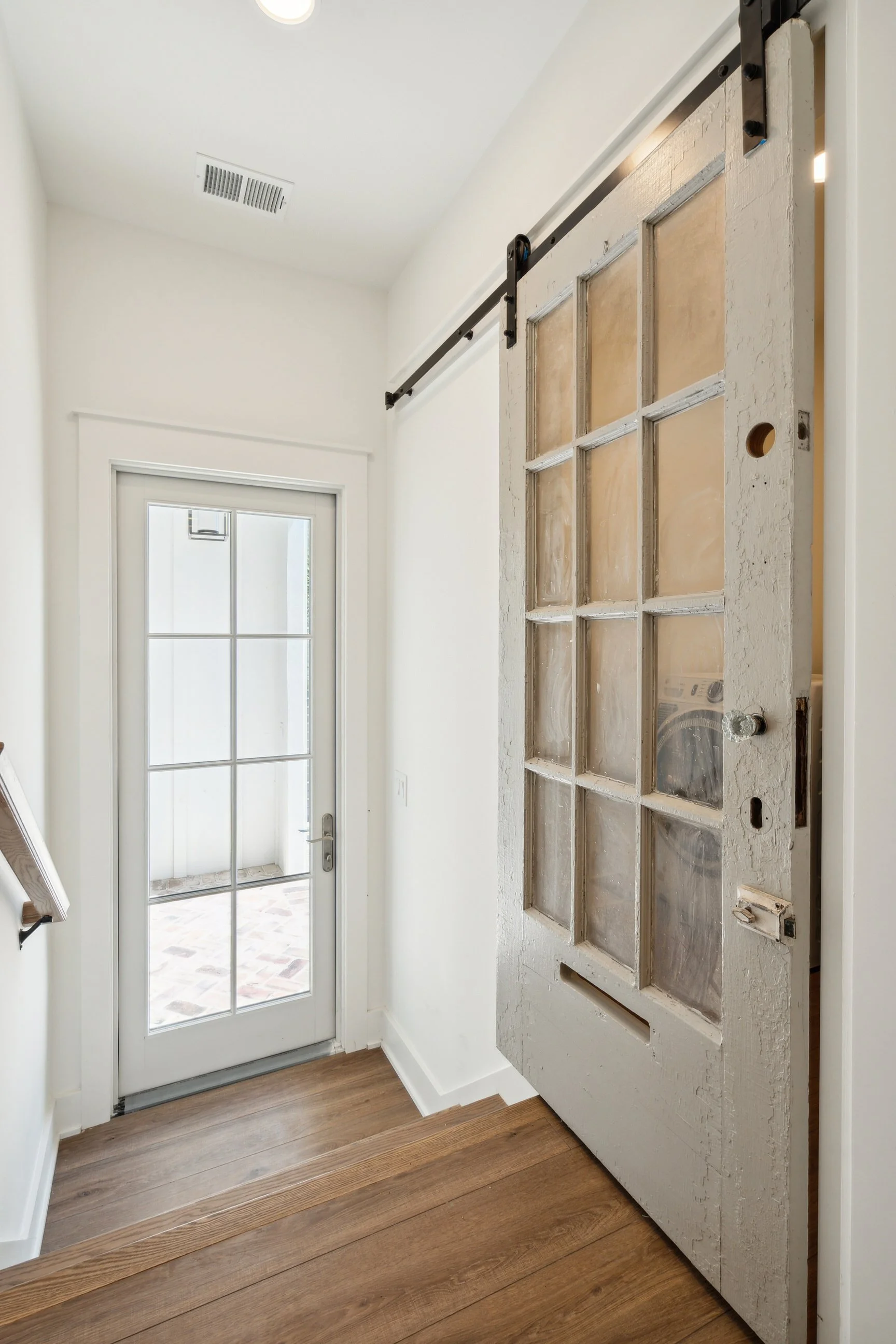 renovated home with stairs and barn door