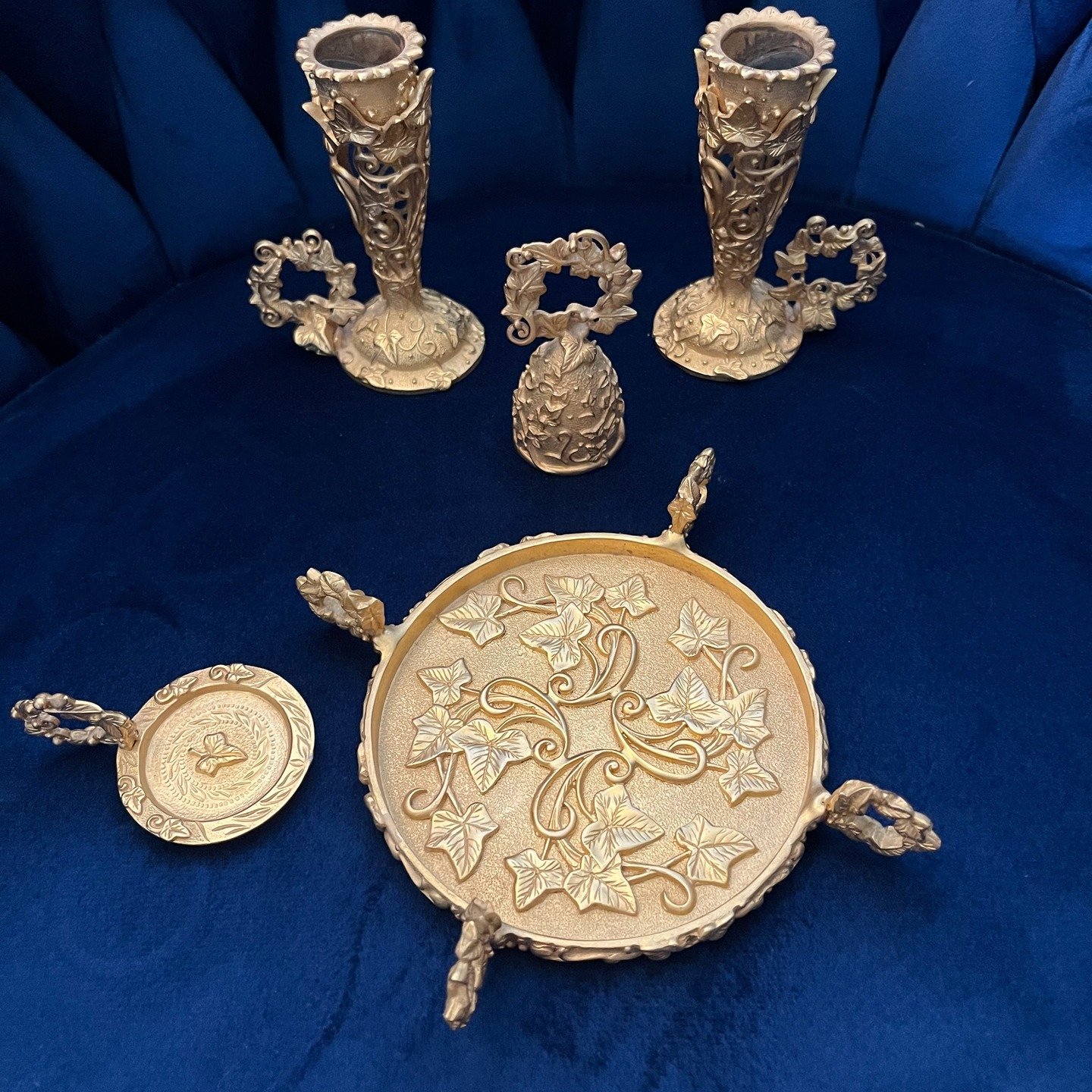 Today&rsquo;s find are these gorgeous gold candle accessories by Sybarite, a line known for its extremely detailed English Ivy pattern. These are high quality cast metal pieces with a thick, textured gold tone plating. Sybarite items are sought after