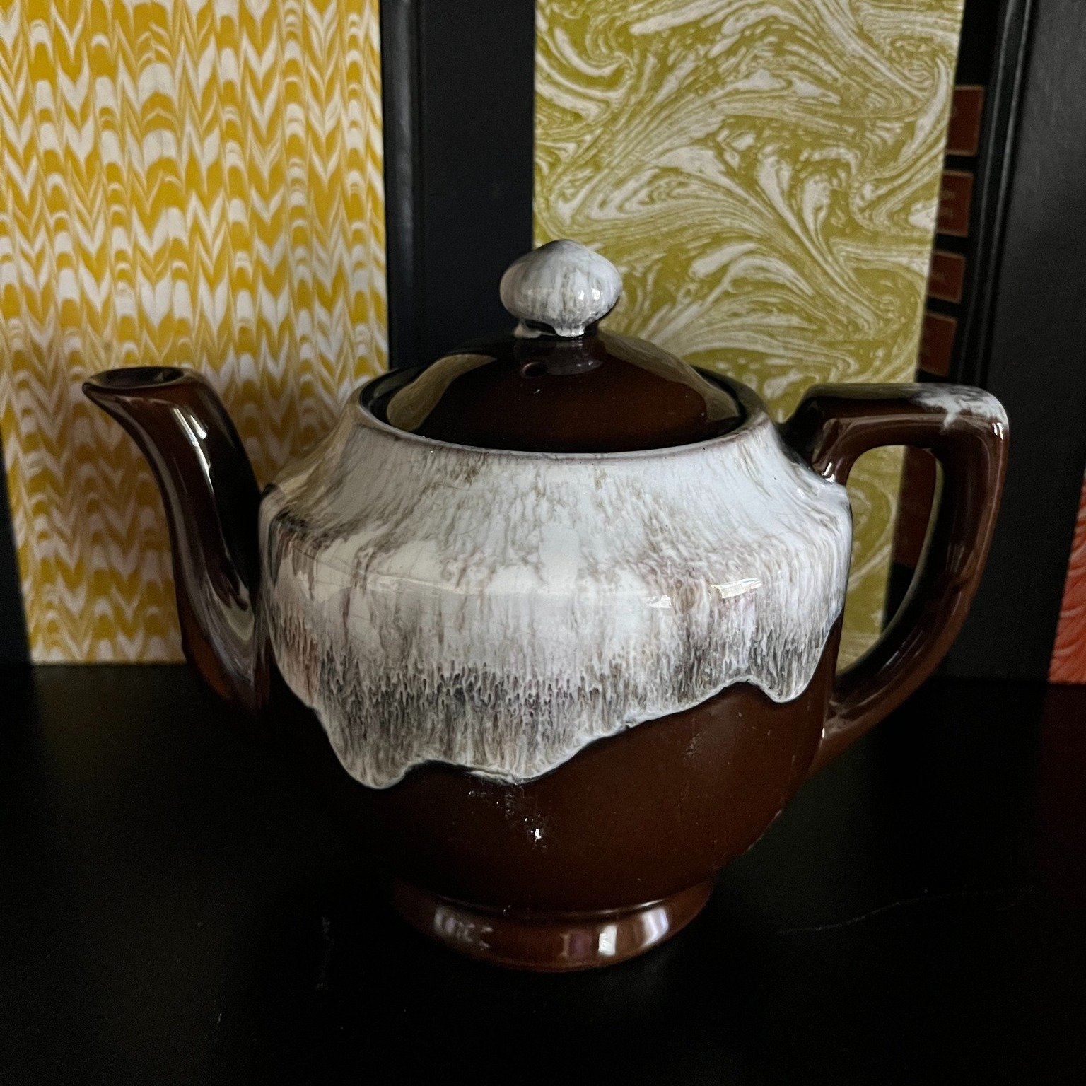 Available at Glam Vintage inside Smith and Co. Mercantile in Port St. Lucie. Visit the booth for current pieces and new arrivals.
The Red Clay Drip Ware Teapot
Japanese export mid-century Red Clay Brown Drip stoneware teapot w snow-cap effect created