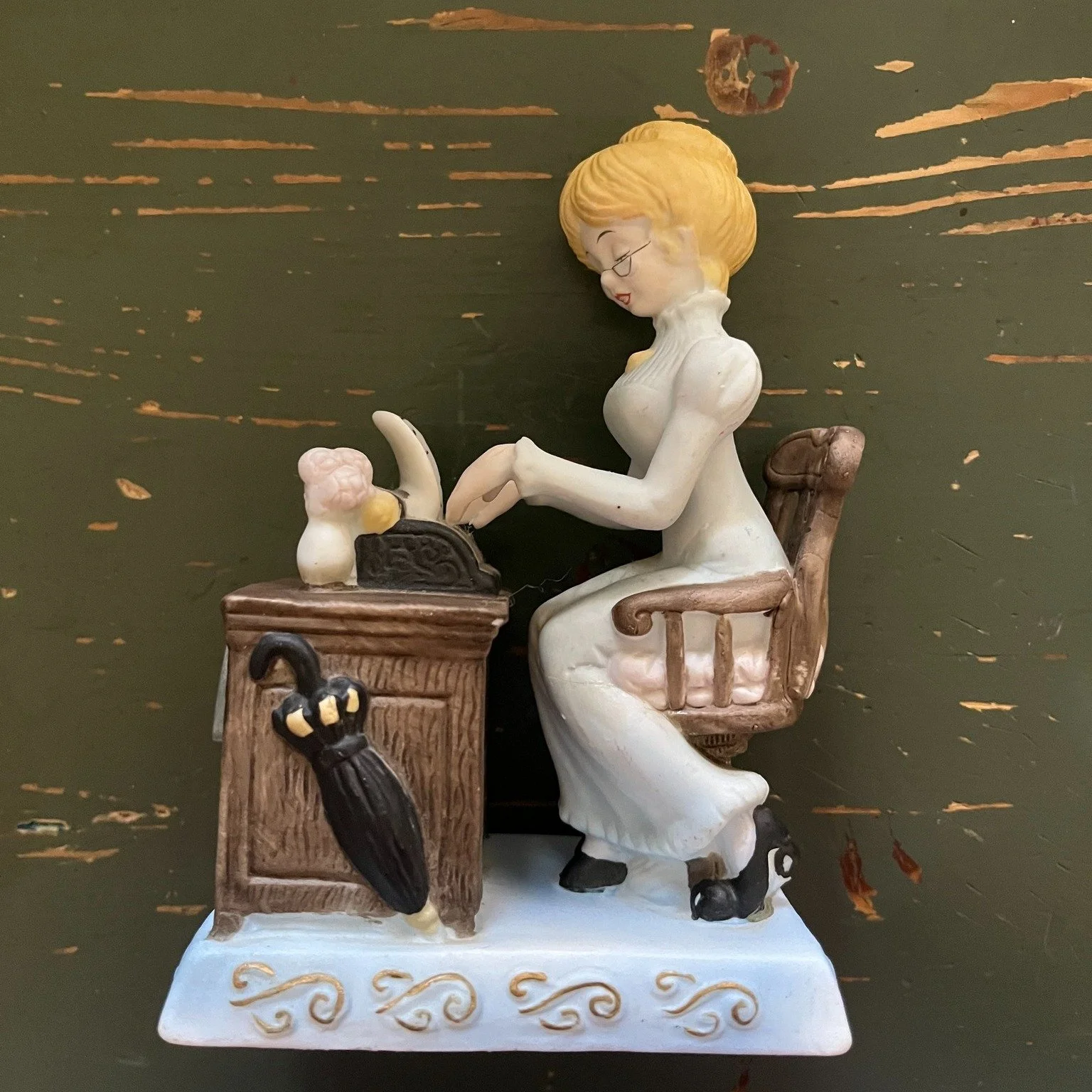 Victorian Revival Bisque Porcelain Musical Figurine Woman Typing Chip Desk 1970s
A beautiful example of mid century giftware. This depicts the Gibson Girl era 1890&ndash;1910. The typewriter was a symbol of independence for women of that time, markin