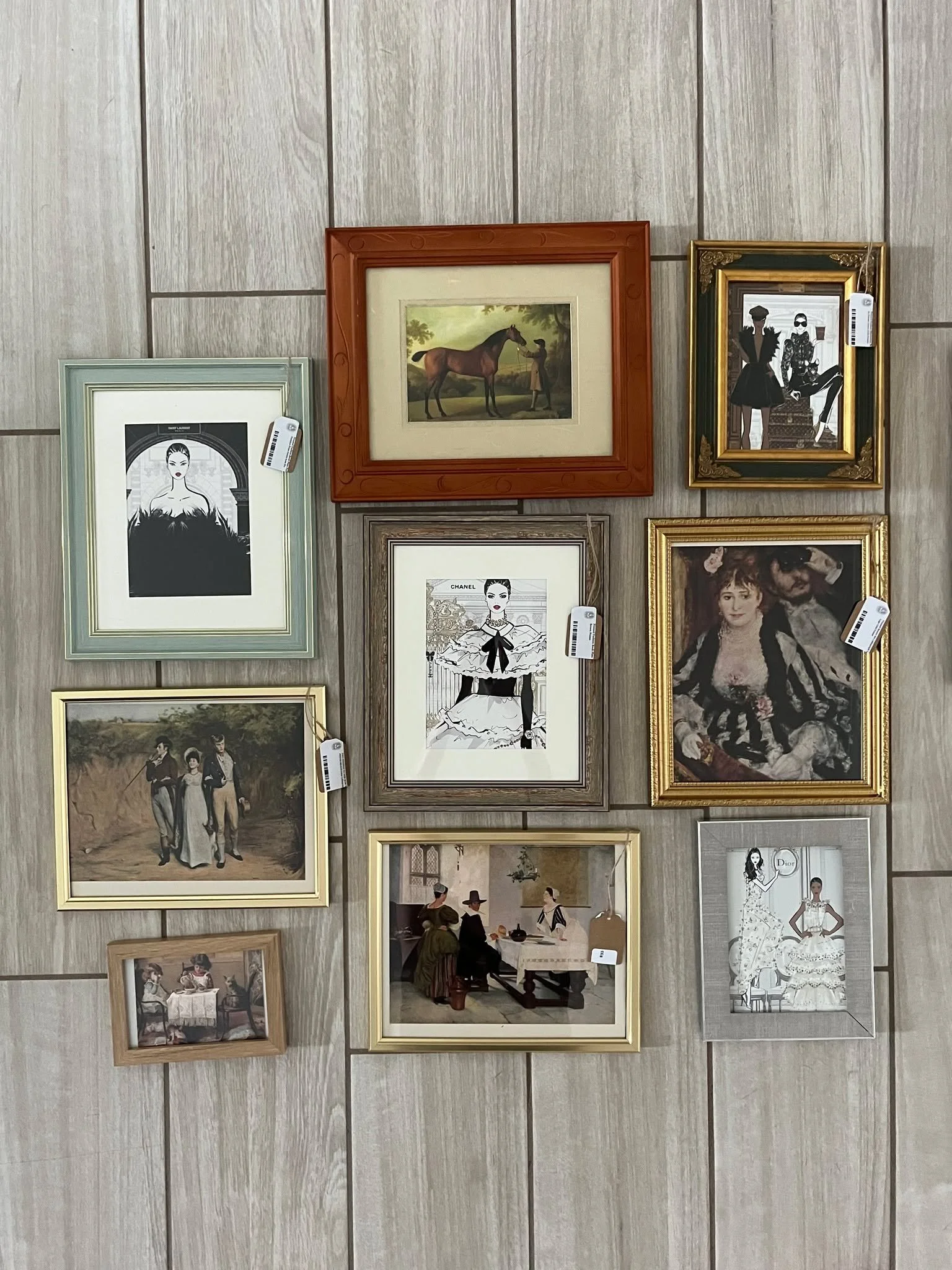Maximalist wall decorating tip:
Instead of matching colors, you match the visual weight and texture. In this photo, the heavy, ornate gold frames provide a consistent texture that allows you to mix wildly different art styles (like a 19th-century hor