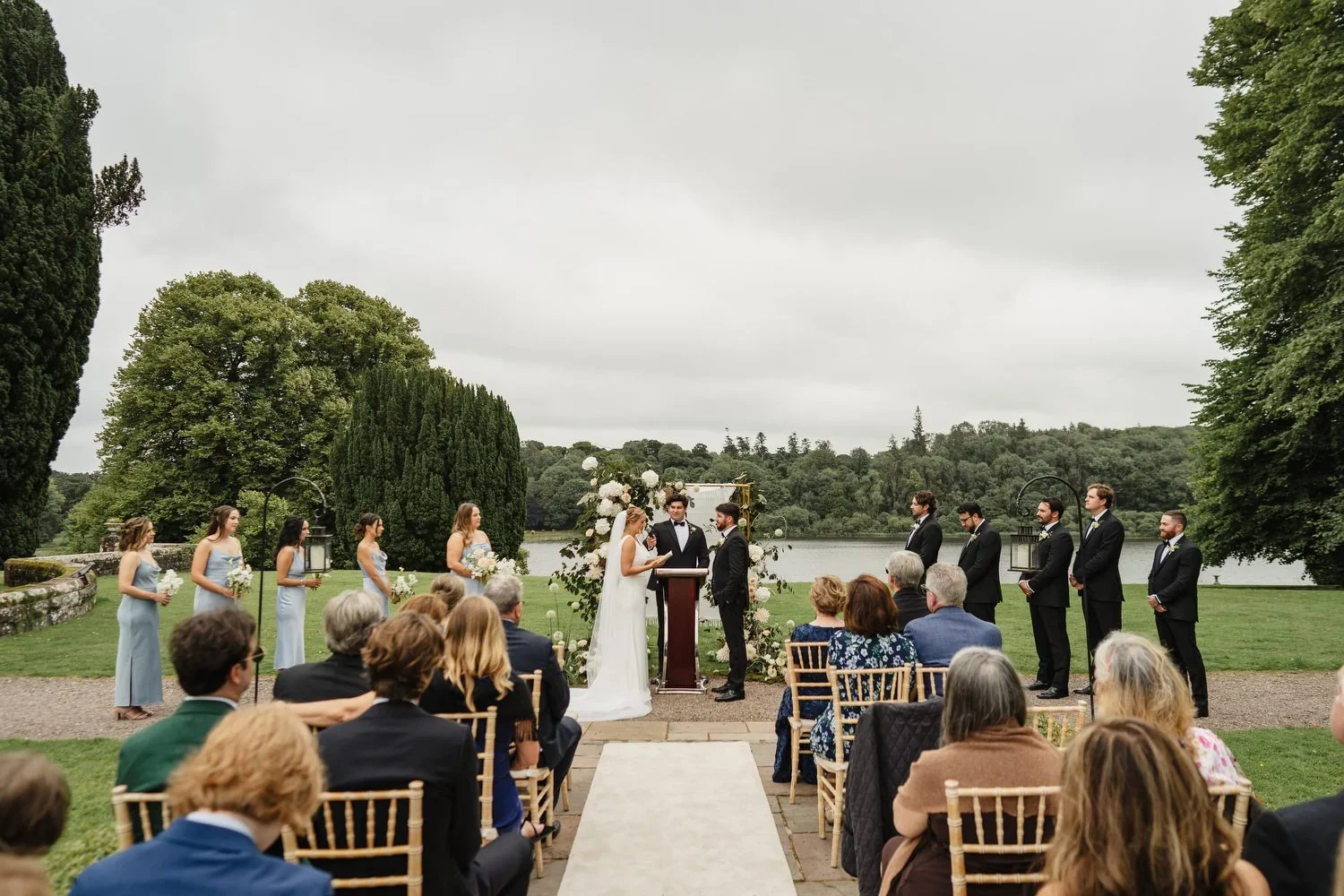 An outdoor ceremony at an american destination wedding in Castle Leslie