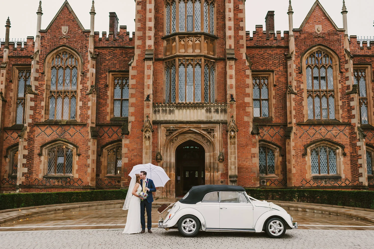 Wedding photograph taken at Queen's University, Belfast on a rainy day