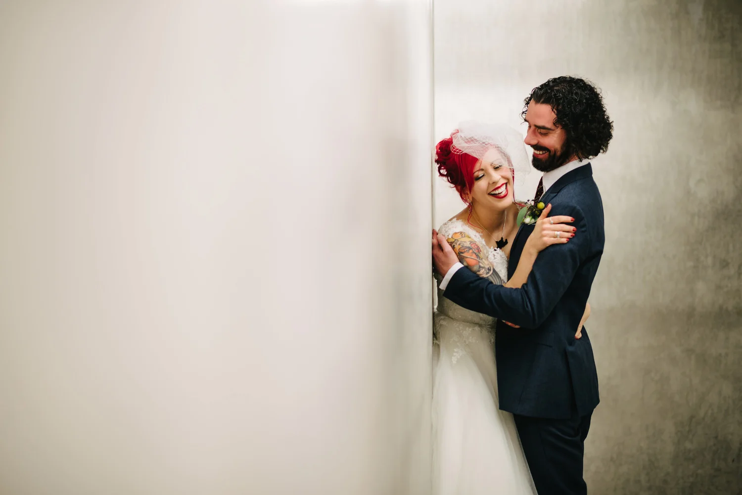 A couple photographed enjoying their wedding in The Mac gallery in Belfast City Centre