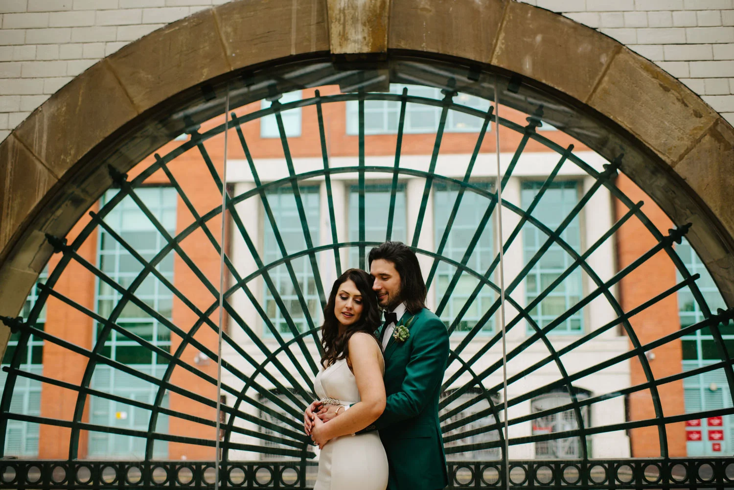 A couple having their wedding photographs taken inside George's Market in Belfast