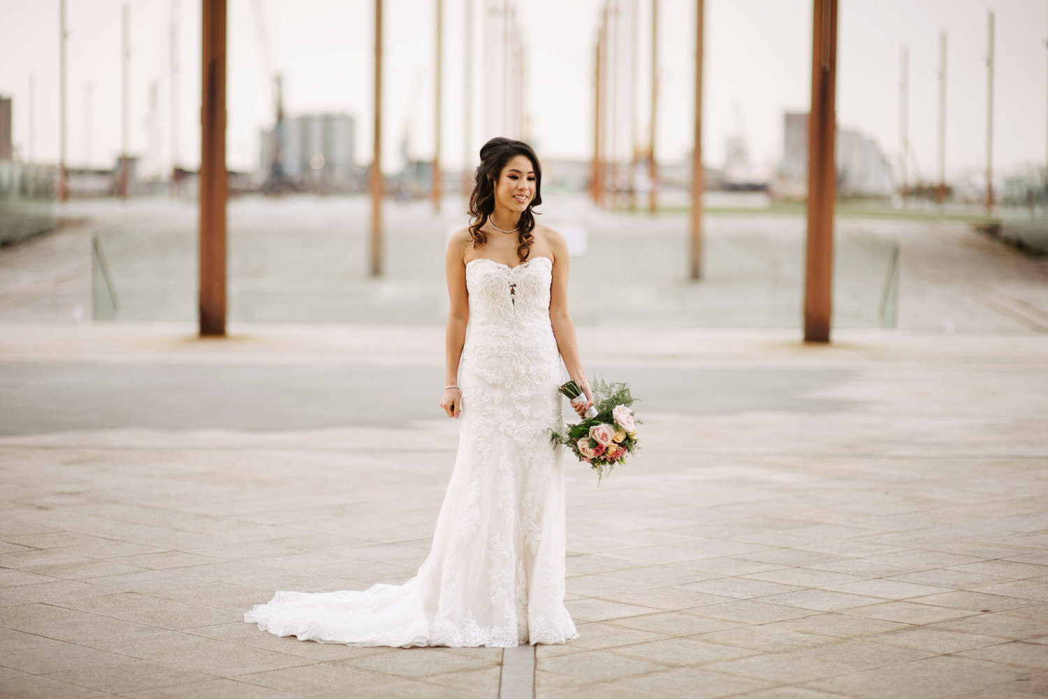 A beautiful Irish-Asian bride posing on titanic slipway belfast.