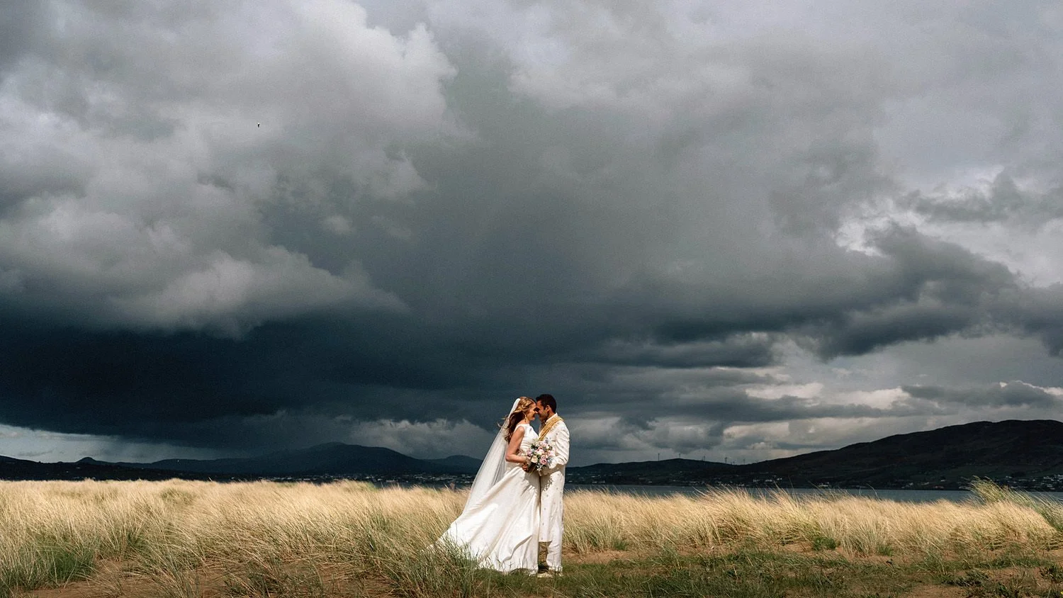 A stunning wedding photograph with a really stormy sky in Donegal, Ireland