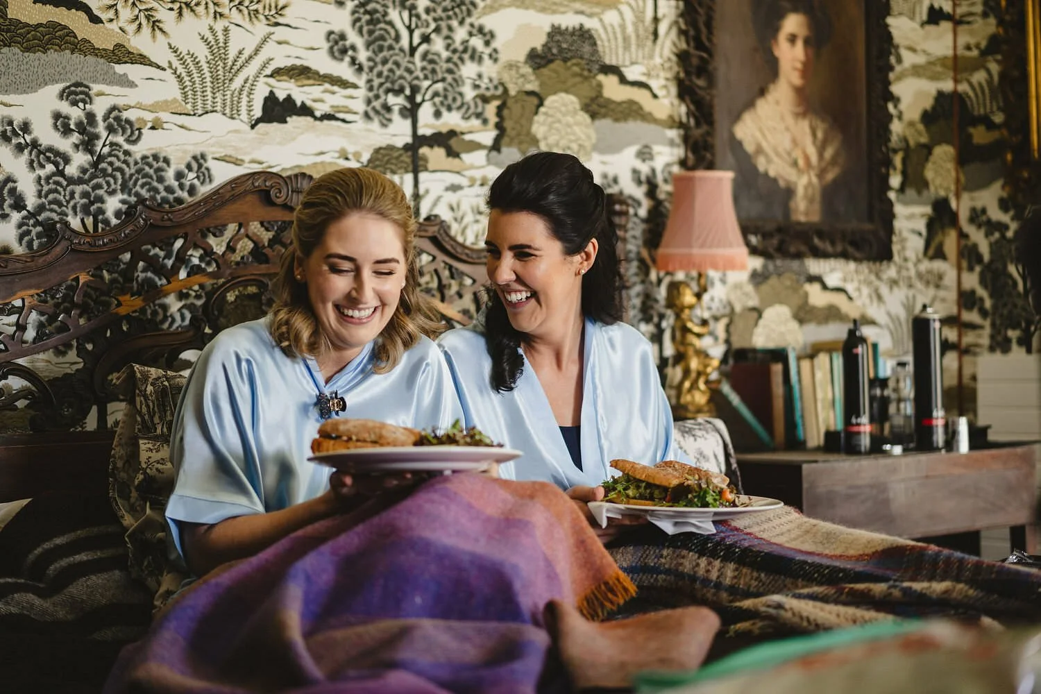 Bridesmaids and bride having breakfast on a wedding morning.