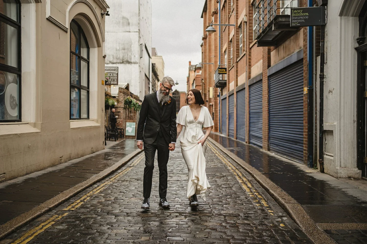  Kathryn and ChrisÕs wedding was supposed to be in Babel rooftop but it burned down 4 days before they were due to get married.  Instead they had their humanist wedding in their own house followed by photos in nearby Ormeau Park and Belfast Cathedral