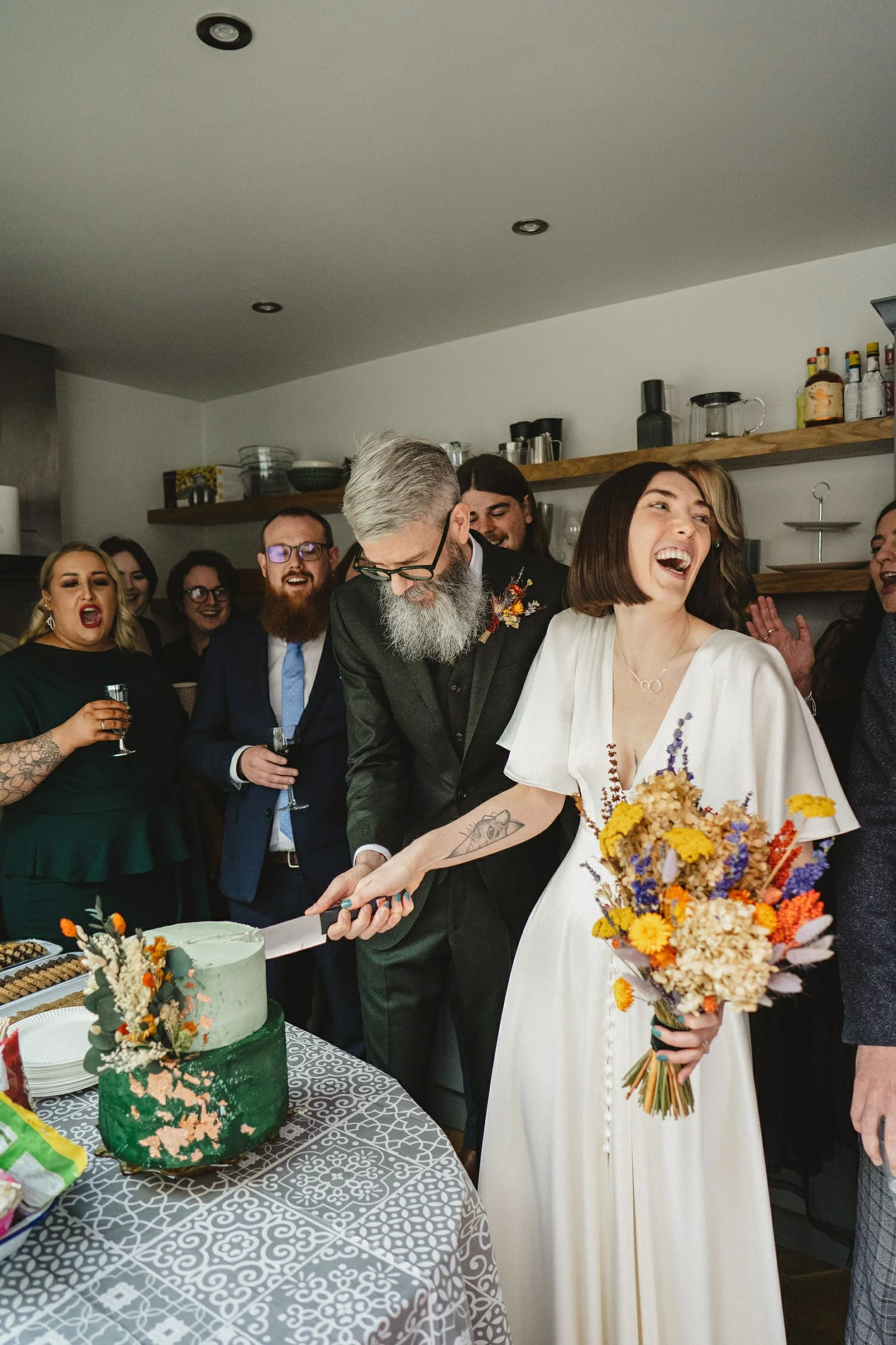  Kathryn and ChrisÕs wedding was supposed to be in Babel rooftop but it burned down 4 days before they were due to get married.  Instead they had their humanist wedding in their own house followed by photos in nearby Ormeau Park and Belfast Cathedral