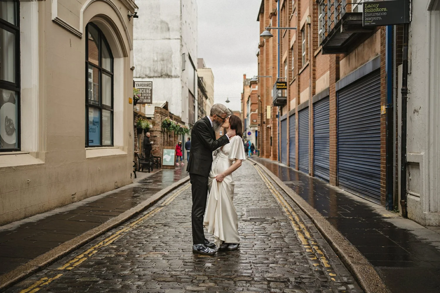  Kathryn and ChrisÕs wedding was supposed to be in Babel rooftop but it burned down 4 days before they were due to get married.  Instead they had their humanist wedding in their own house followed by photos in nearby Ormeau Park and Belfast Cathedral