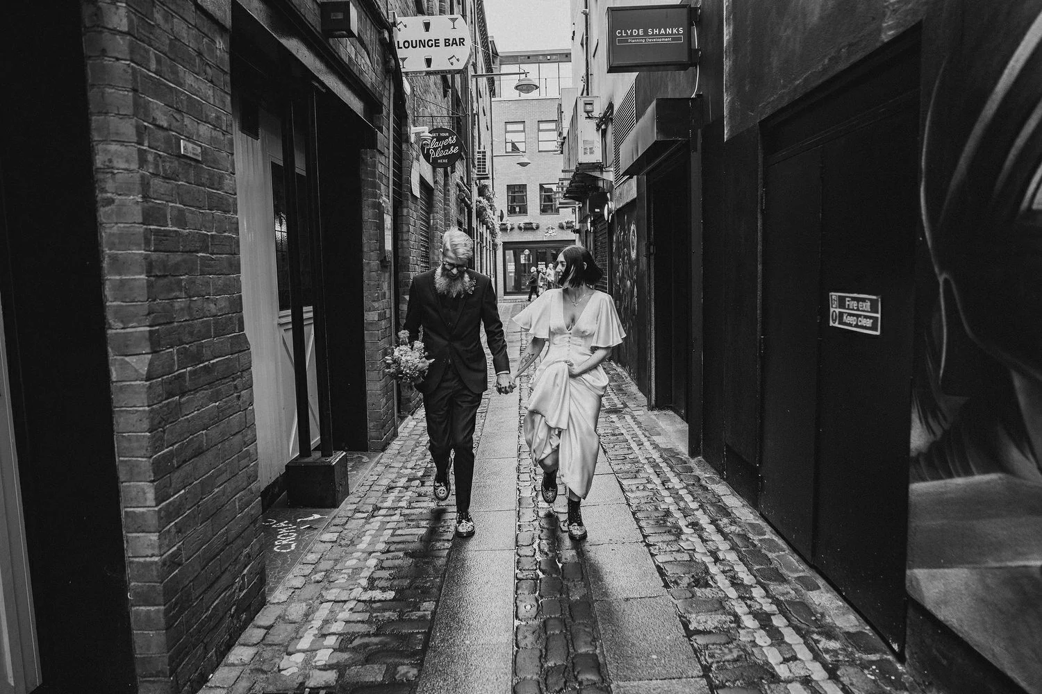  Kathryn and ChrisÕs wedding was supposed to be in Babel rooftop but it burned down 4 days before they were due to get married.  Instead they had their humanist wedding in their own house followed by photos in nearby Ormeau Park and Belfast Cathedral
