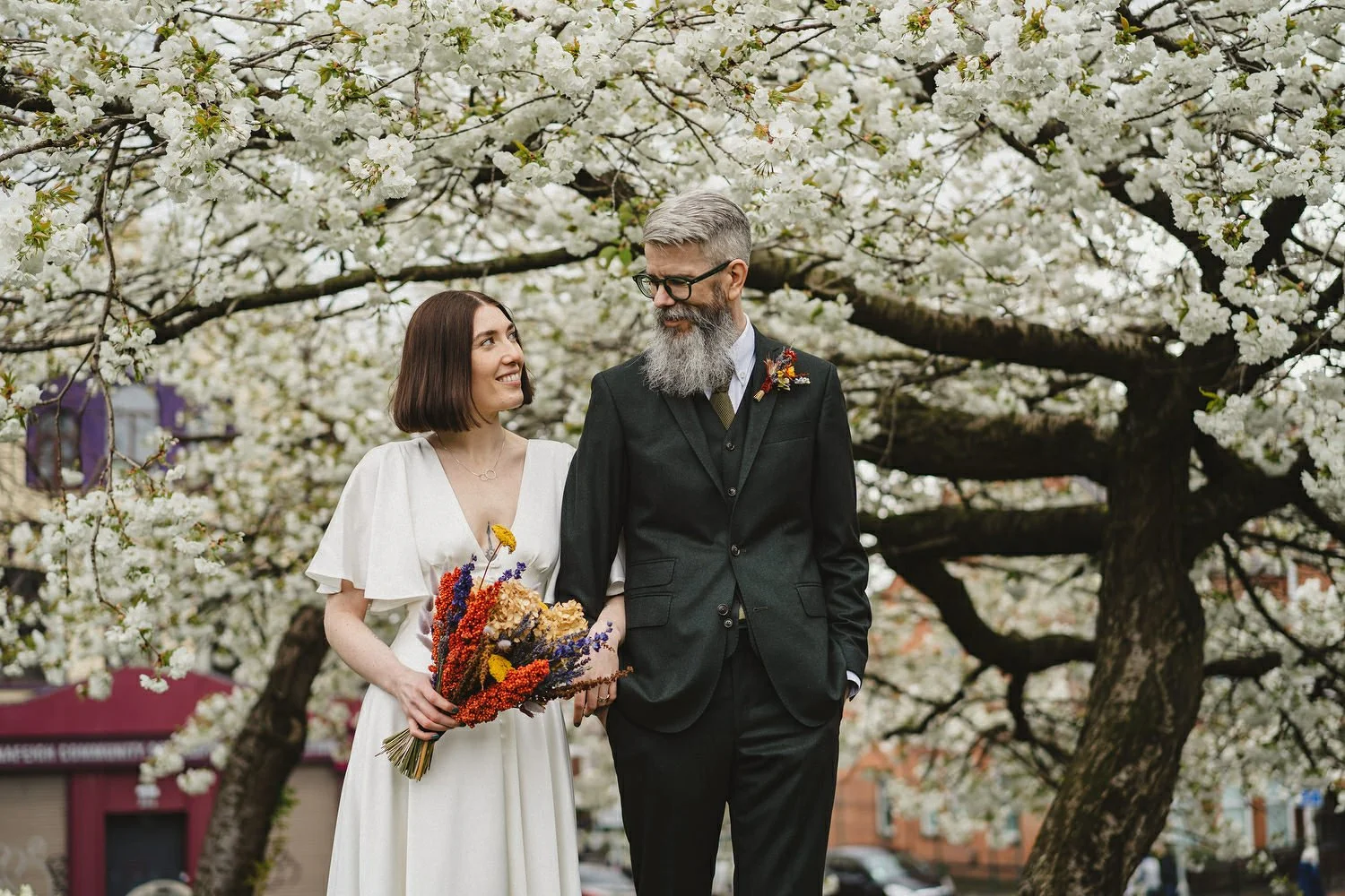  Kathryn and ChrisÕs wedding was supposed to be in Babel rooftop but it burned down 4 days before they were due to get married.  Instead they had their humanist wedding in their own house followed by photos in nearby Ormeau Park and Belfast Cathedral