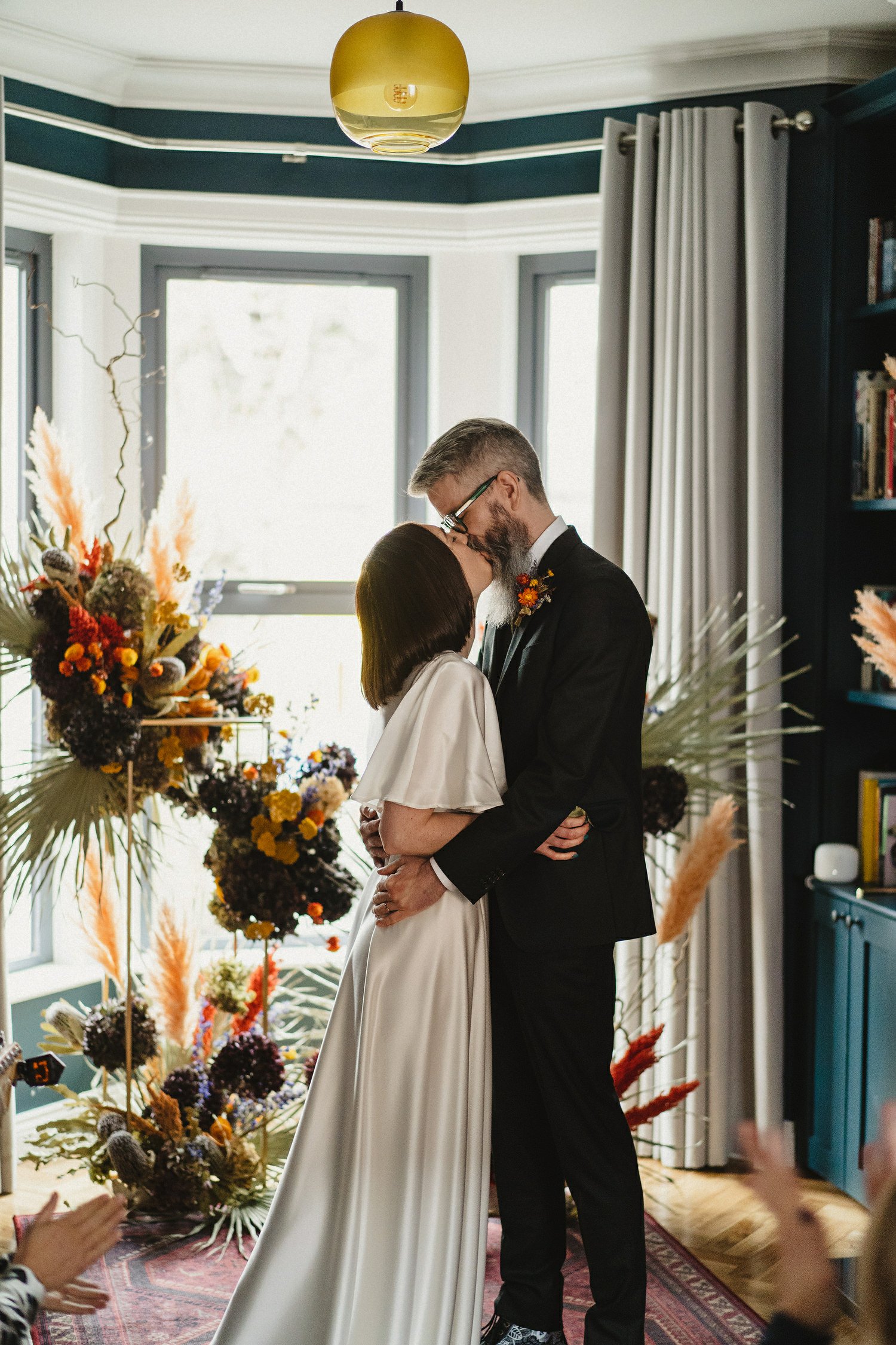  Kathryn and ChrisÕs wedding was supposed to be in Babel rooftop but it burned down 4 days before they were due to get married.  Instead they had their humanist wedding in their own house followed by photos in nearby Ormeau Park and Belfast Cathedral