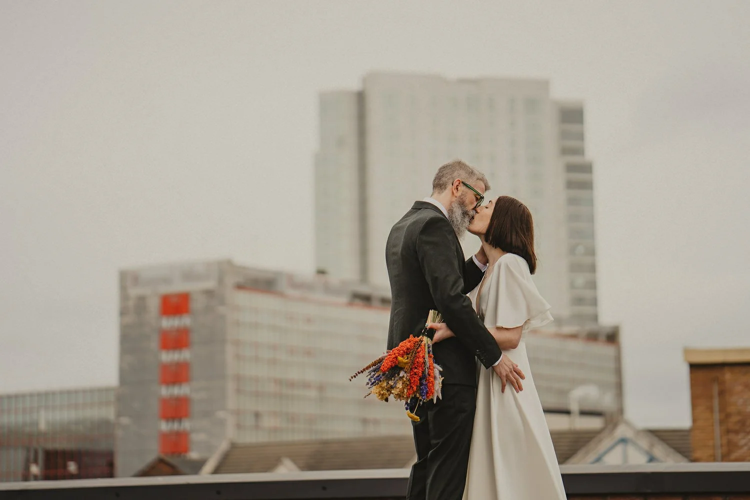  Kathryn and ChrisÕs wedding was supposed to be in Babel rooftop but it burned down 4 days before they were due to get married.  Instead they had their humanist wedding in their own house followed by photos in nearby Ormeau Park and Belfast Cathedral