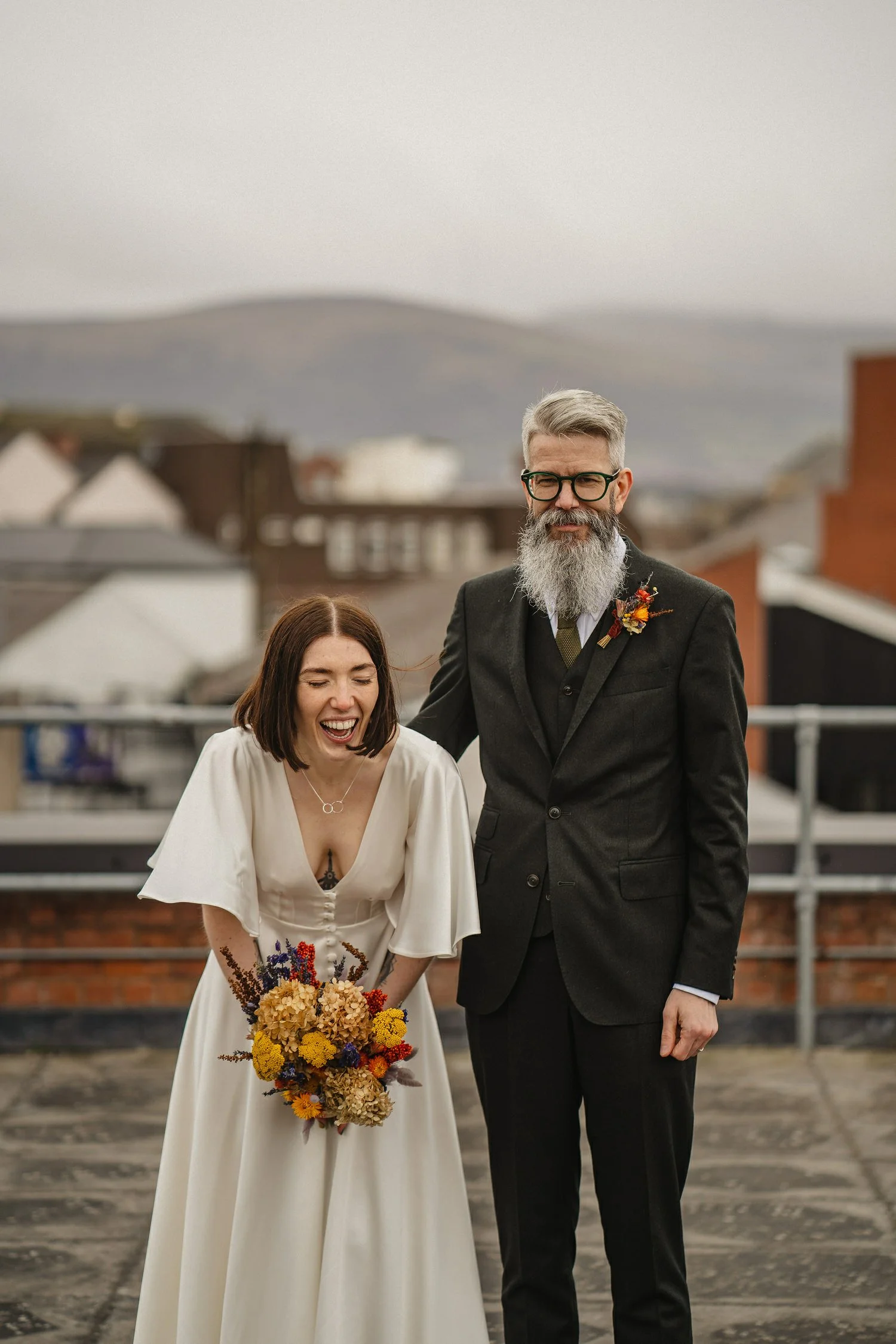  Kathryn and ChrisÕs wedding was supposed to be in Babel rooftop but it burned down 4 days before they were due to get married.  Instead they had their humanist wedding in their own house followed by photos in nearby Ormeau Park and Belfast Cathedral