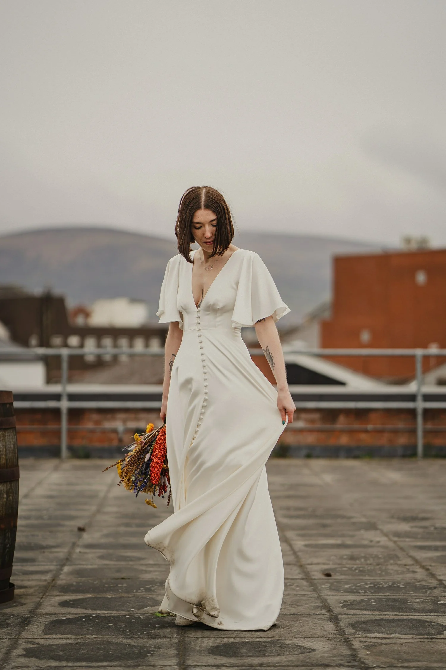  Kathryn and ChrisÕs wedding was supposed to be in Babel rooftop but it burned down 4 days before they were due to get married.  Instead they had their humanist wedding in their own house followed by photos in nearby Ormeau Park and Belfast Cathedral