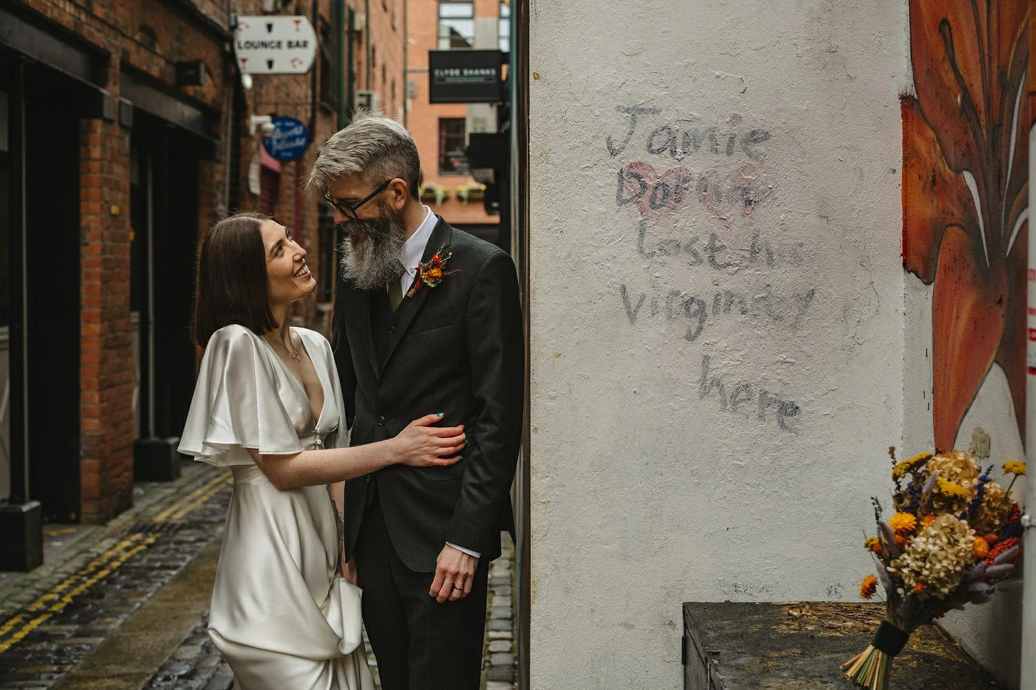  Kathryn and ChrisÕs wedding was supposed to be in Babel rooftop but it burned down 4 days before they were due to get married.  Instead they had their humanist wedding in their own house followed by photos in nearby Ormeau Park and Belfast Cathedral