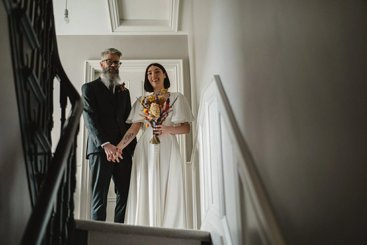  Kathryn and ChrisÕs wedding was supposed to be in Babel rooftop but it burned down 4 days before they were due to get married.  Instead they had their humanist wedding in their own house followed by photos in nearby Ormeau Park and Belfast Cathedral