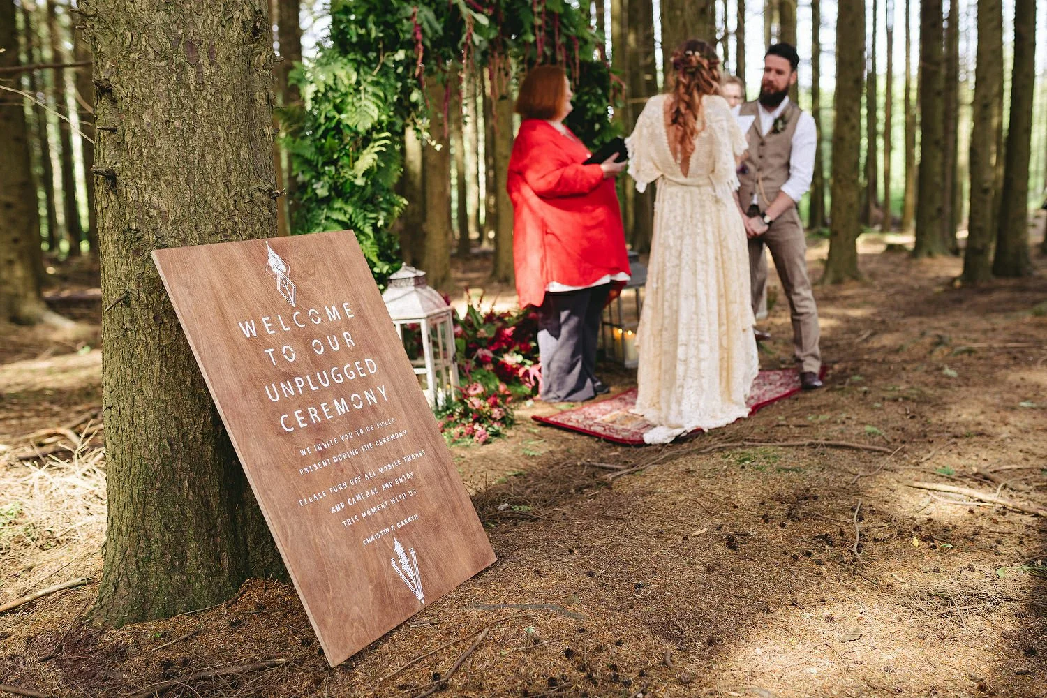 An unplugged wedding sign for an outdoor wedding.