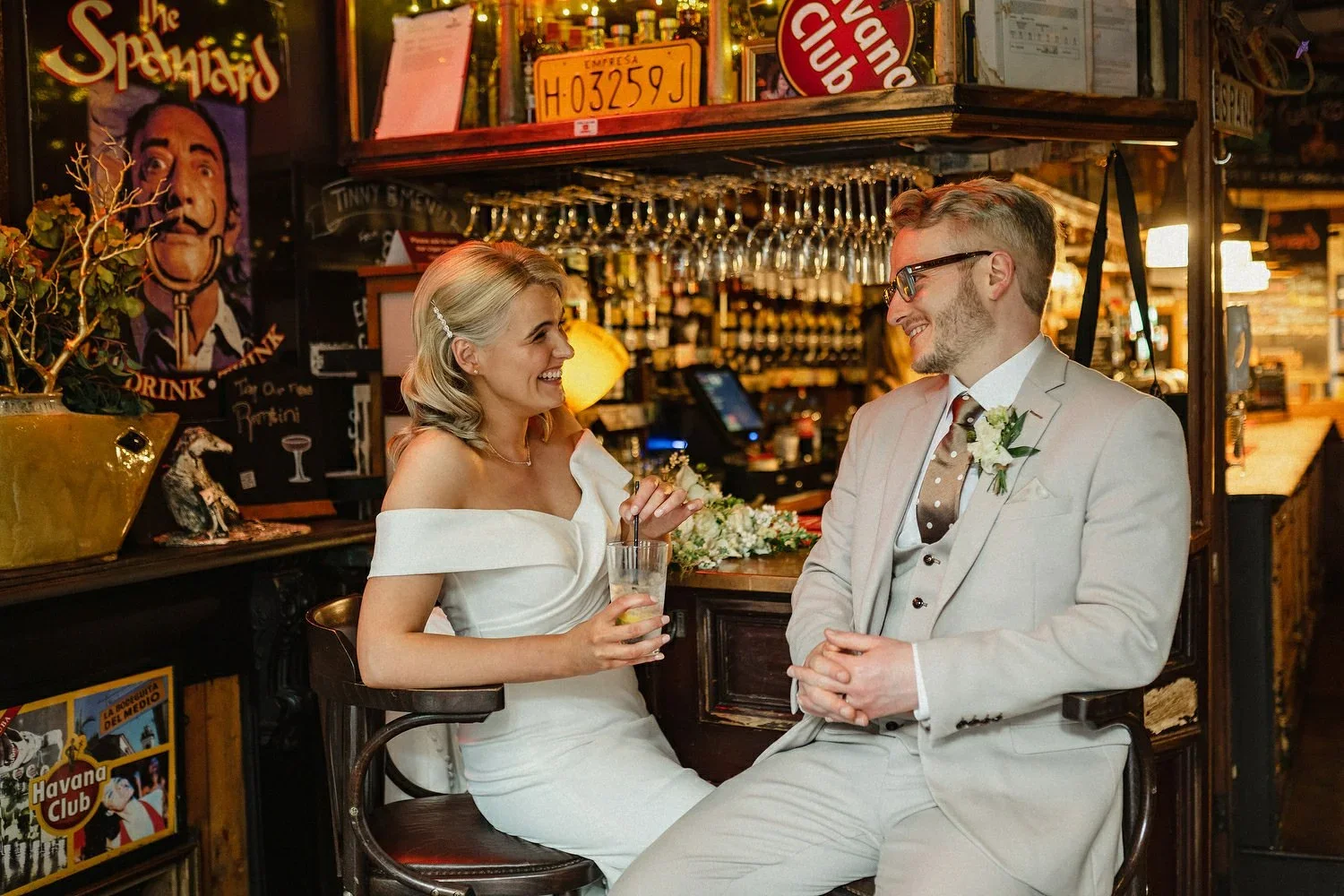 A bride and groom enjoy a drink in the Spaniard Bar