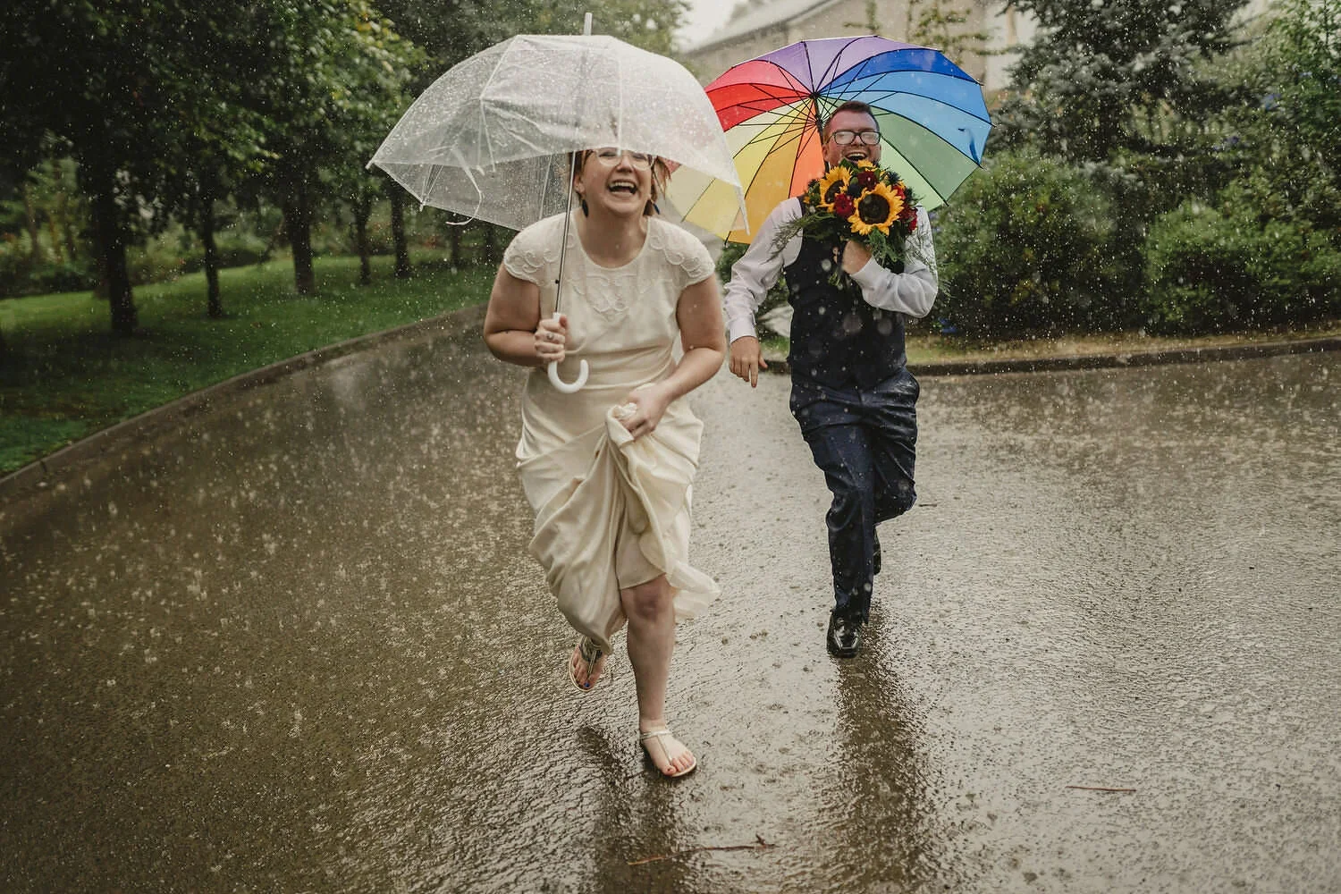 A couple run to get out of the rain during an elopement in Northern Ireland.