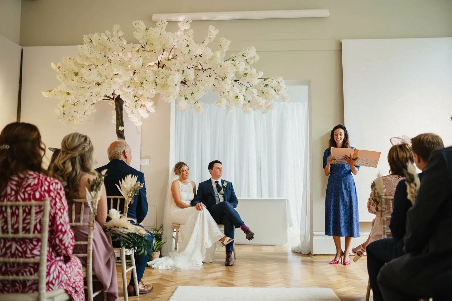 A Bride and Groom at their wedding ceremony in the Belfast Room at Ulster Museum