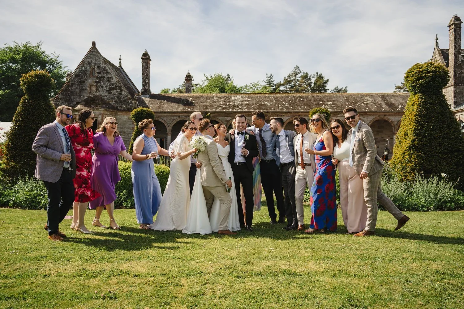 Wedding guests enjoying themselves in the gardens at Castle Leslie
