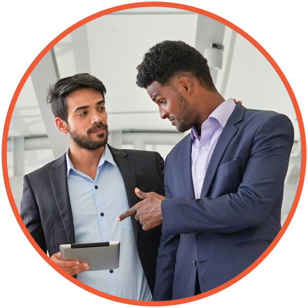 Project manager and colleague talking together in an office