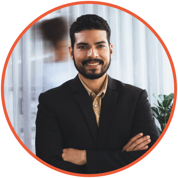 Male project manager standing at a desk in an office