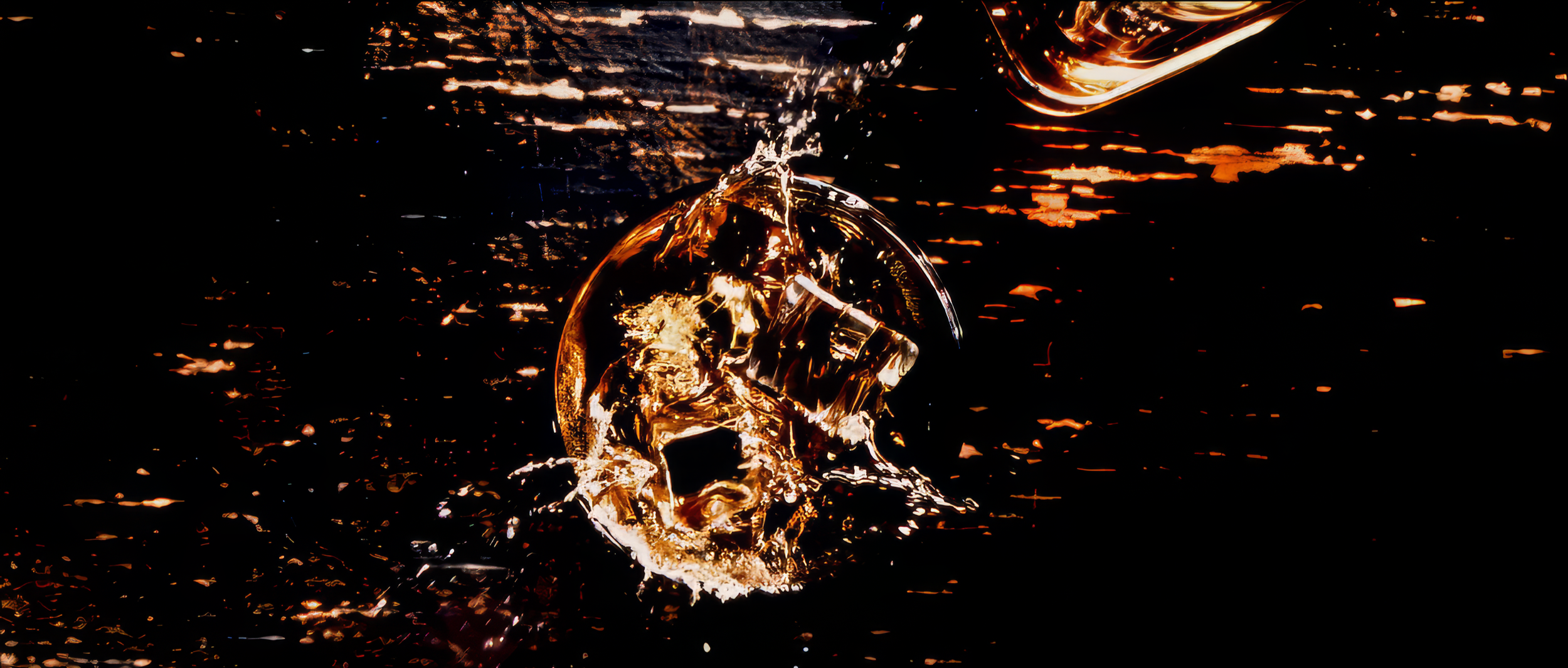 Close-up of a melting metallic skull sculpture immersed in a dark liquid with reflections of orange and yellow lights.