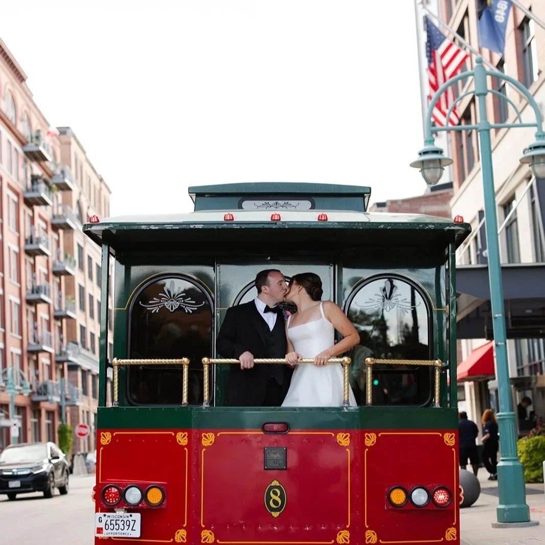 Couple kissing on a vintage trolley in the Third Ward of Milwaukee