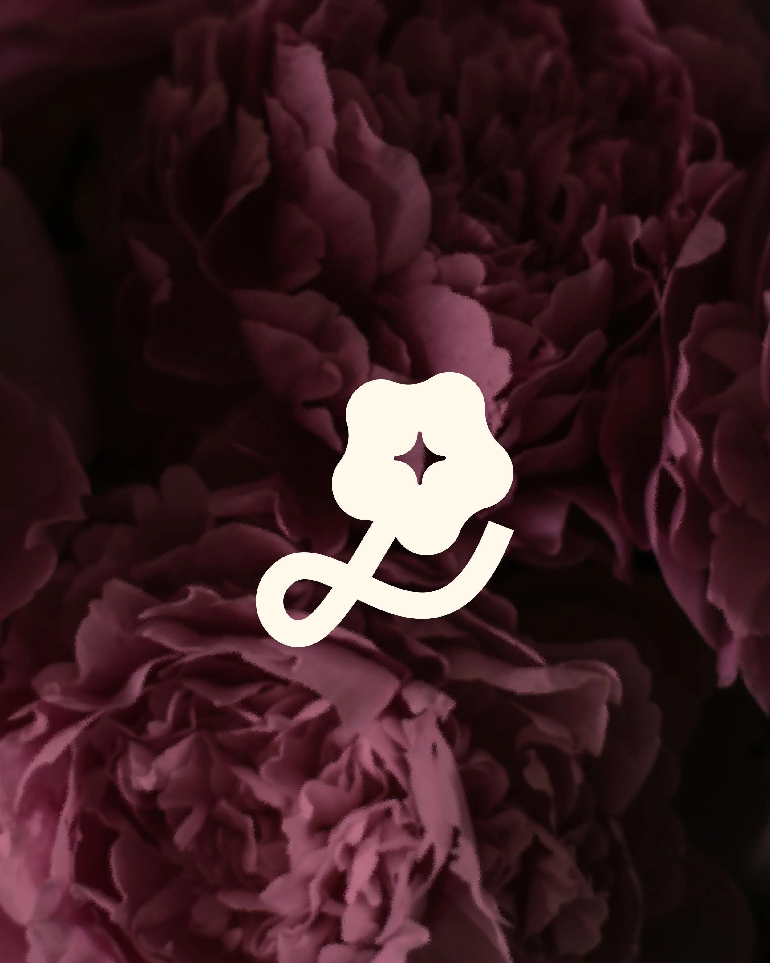 Blurred background of pink flowers with a white flower-shaped sparkle sticker overlay.