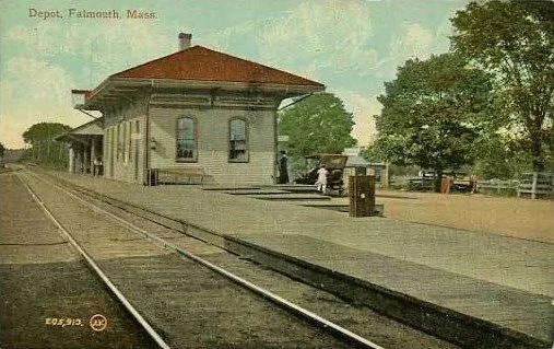 Historic train depot with platform, tracks, and waiting area at Falmouth, Massachusetts.
