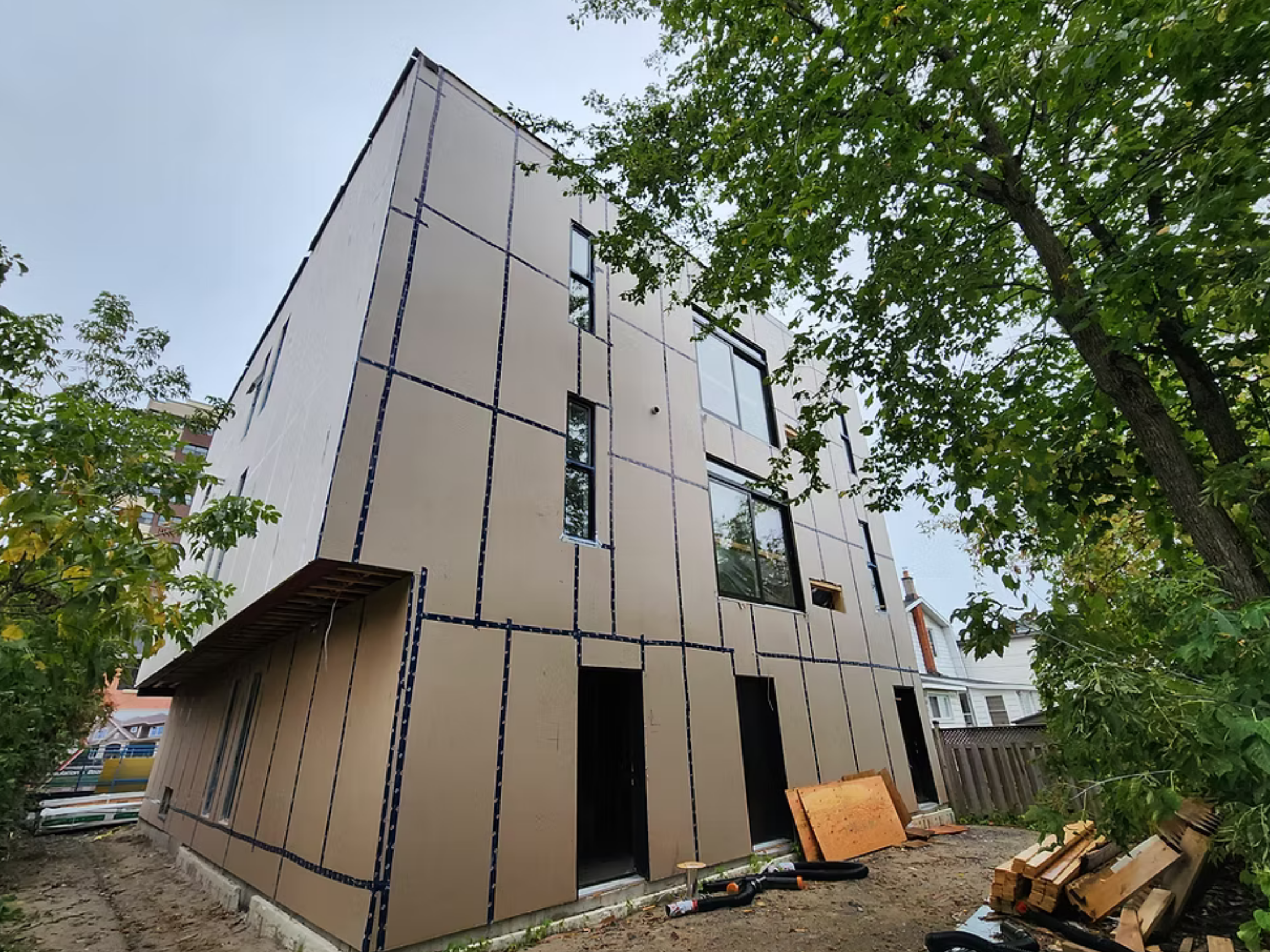 incomplete exterior image of a multi-unit residential infill titled "Grant" using the HARMONIC building envelope.