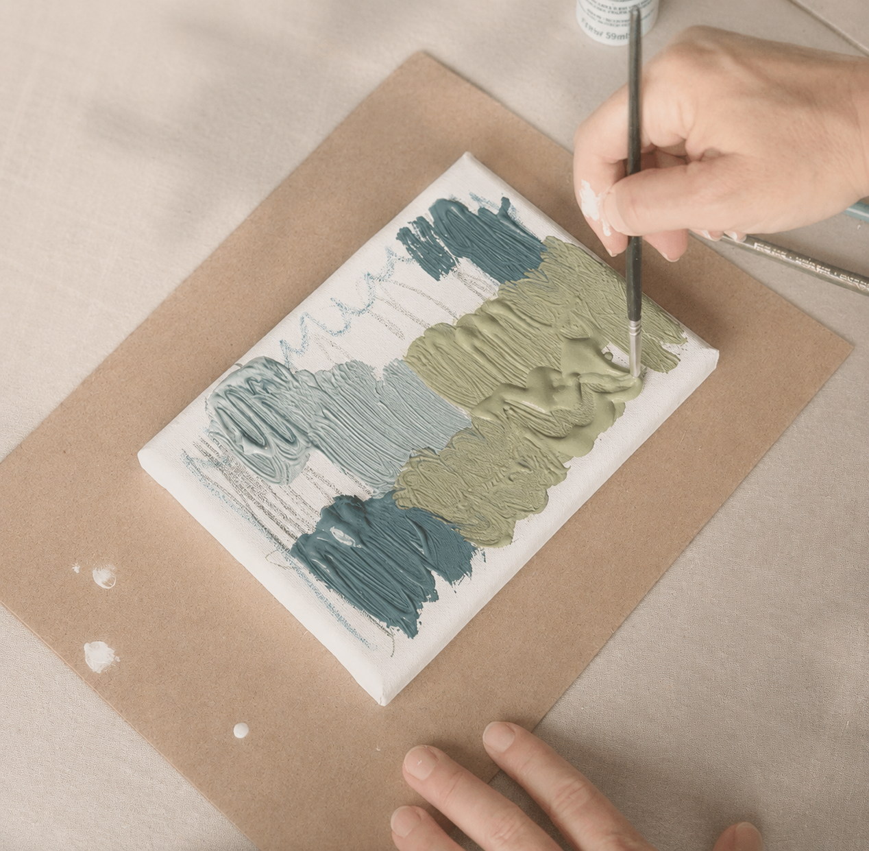 Permission to Paint Kit with canvas, paints, brushes, and reflection cards for stress relief and emotional processing.