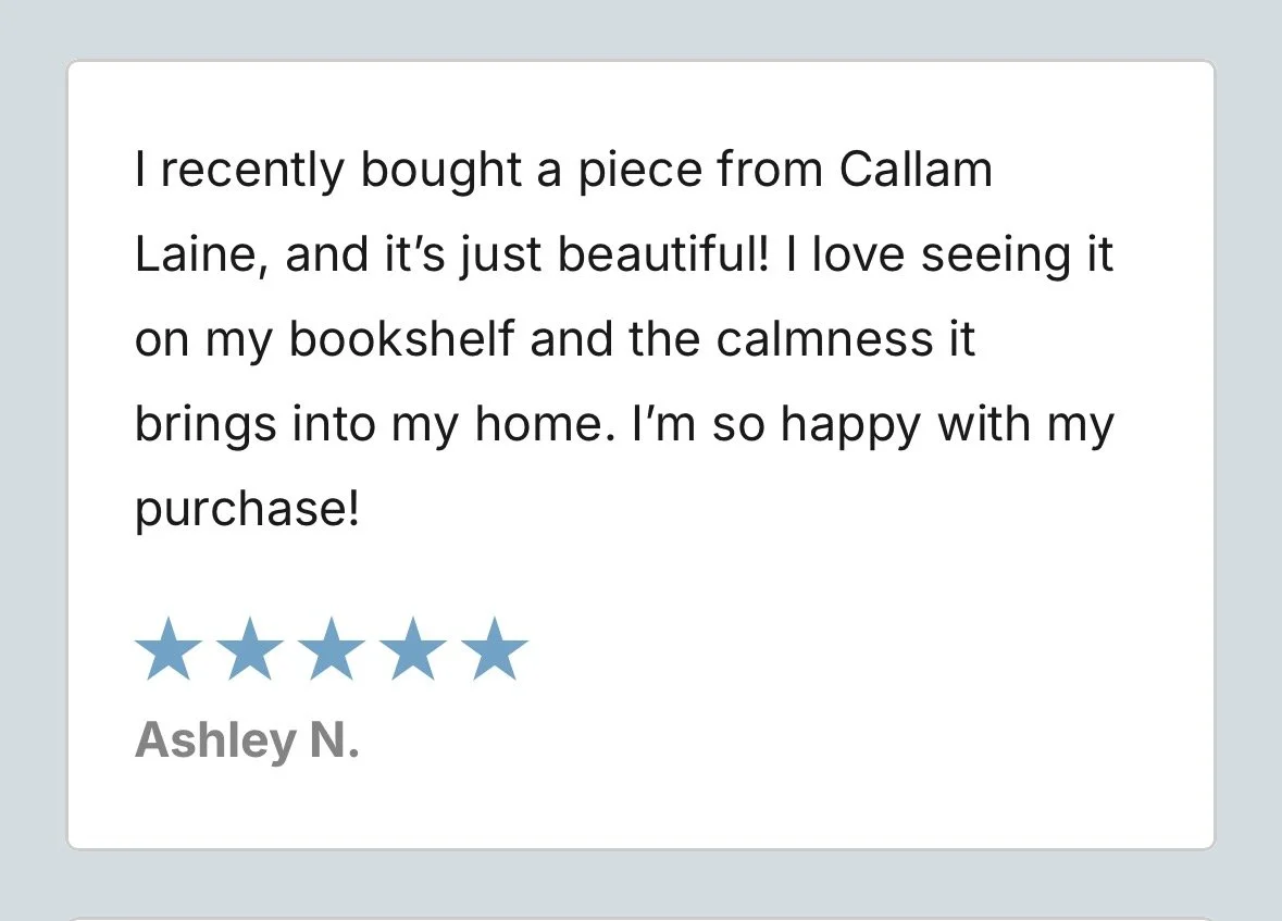 Customer review praising a piece of artwork purchased from Callam Laine, describing it as beautiful and calming, and expressing happiness with the purchase, accompanied by a five-star rating.