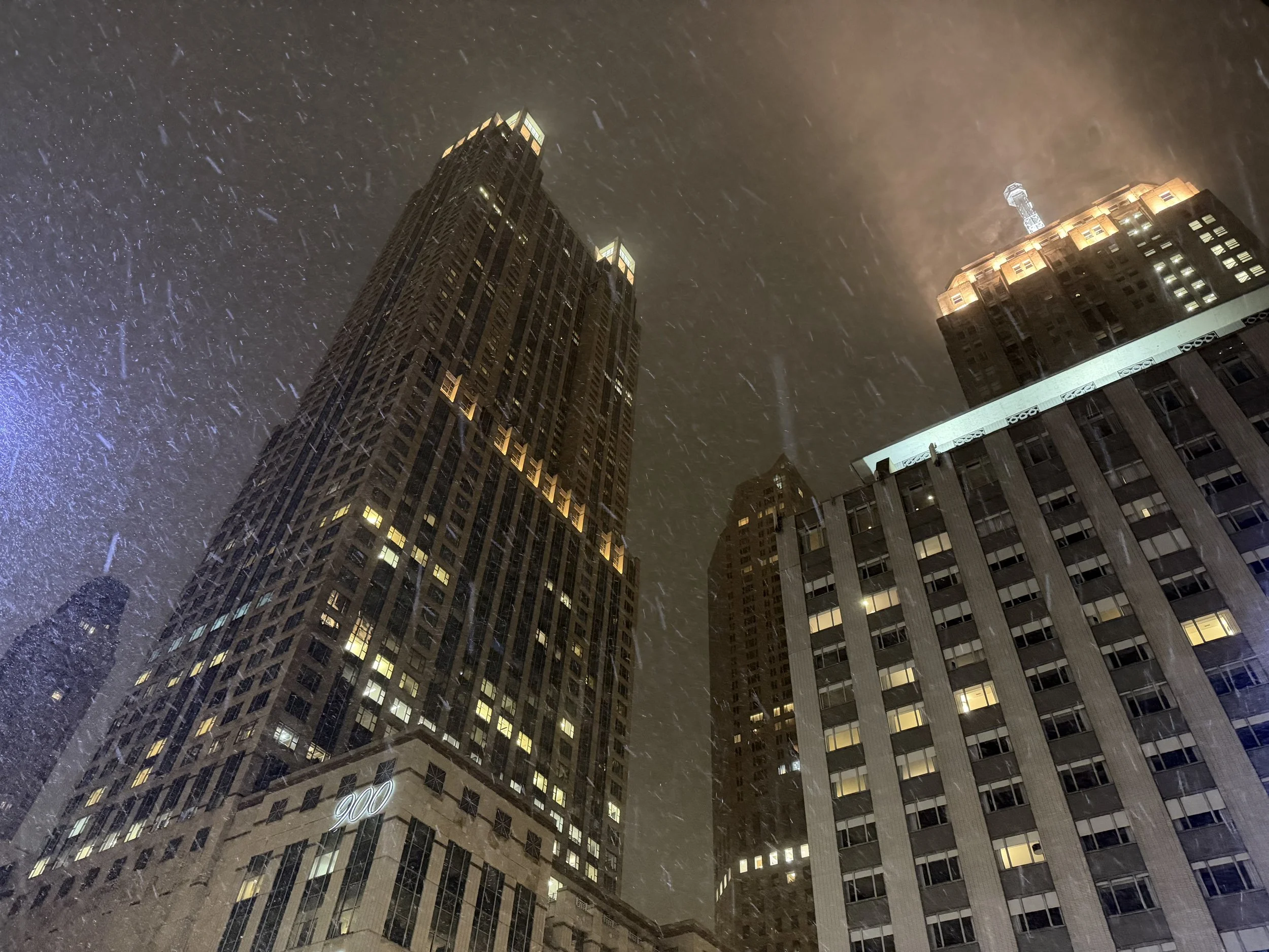 A background photo of a snowy Chicago evening