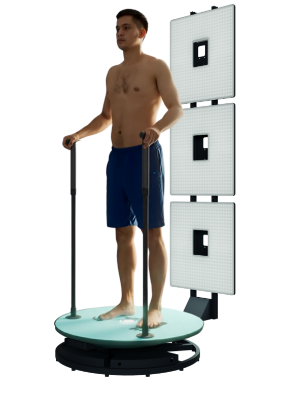 A man standing on a skin cancer screening machine holding onto support bars