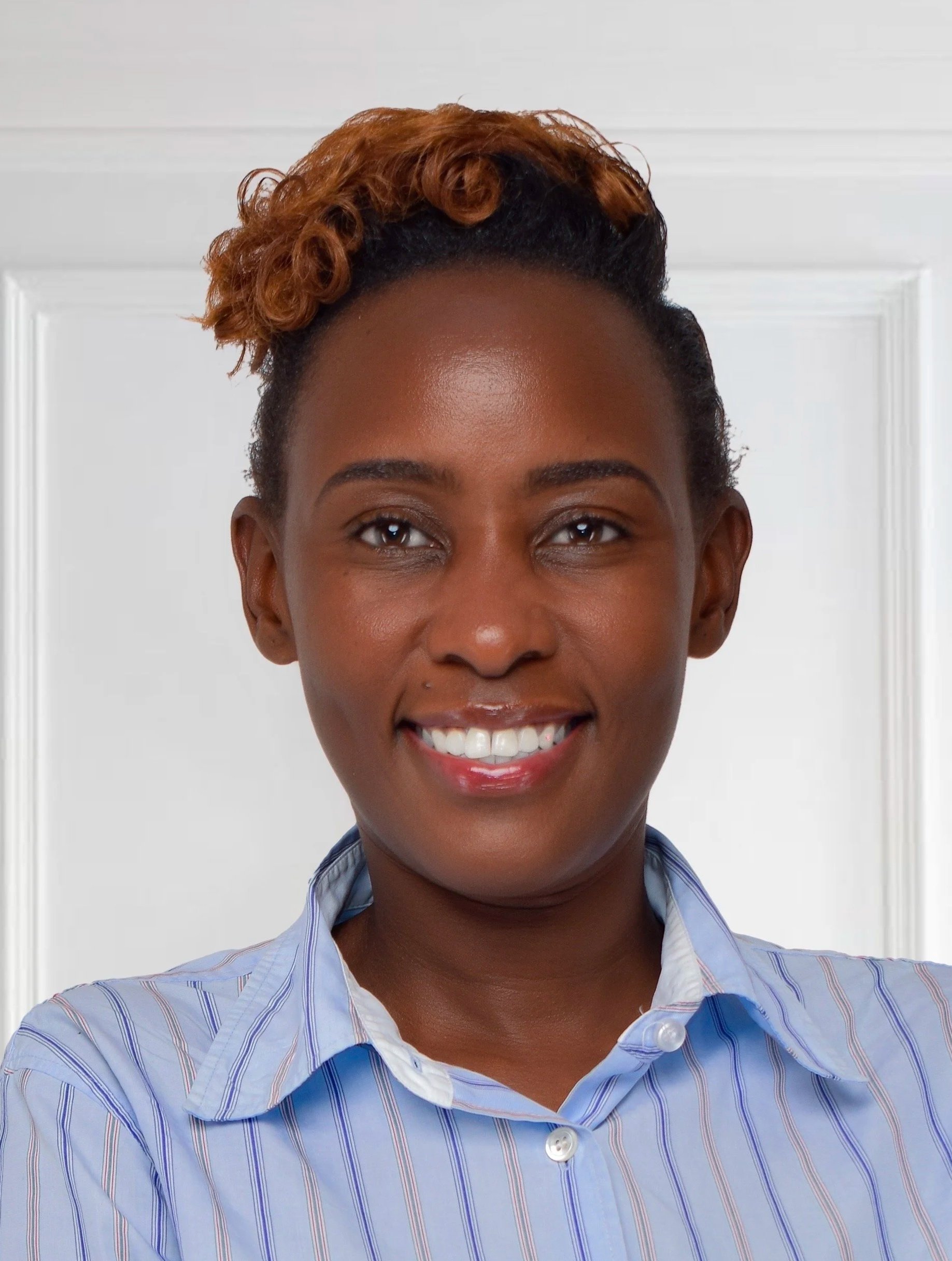 A young business woman with a light-striped--colored shirt
