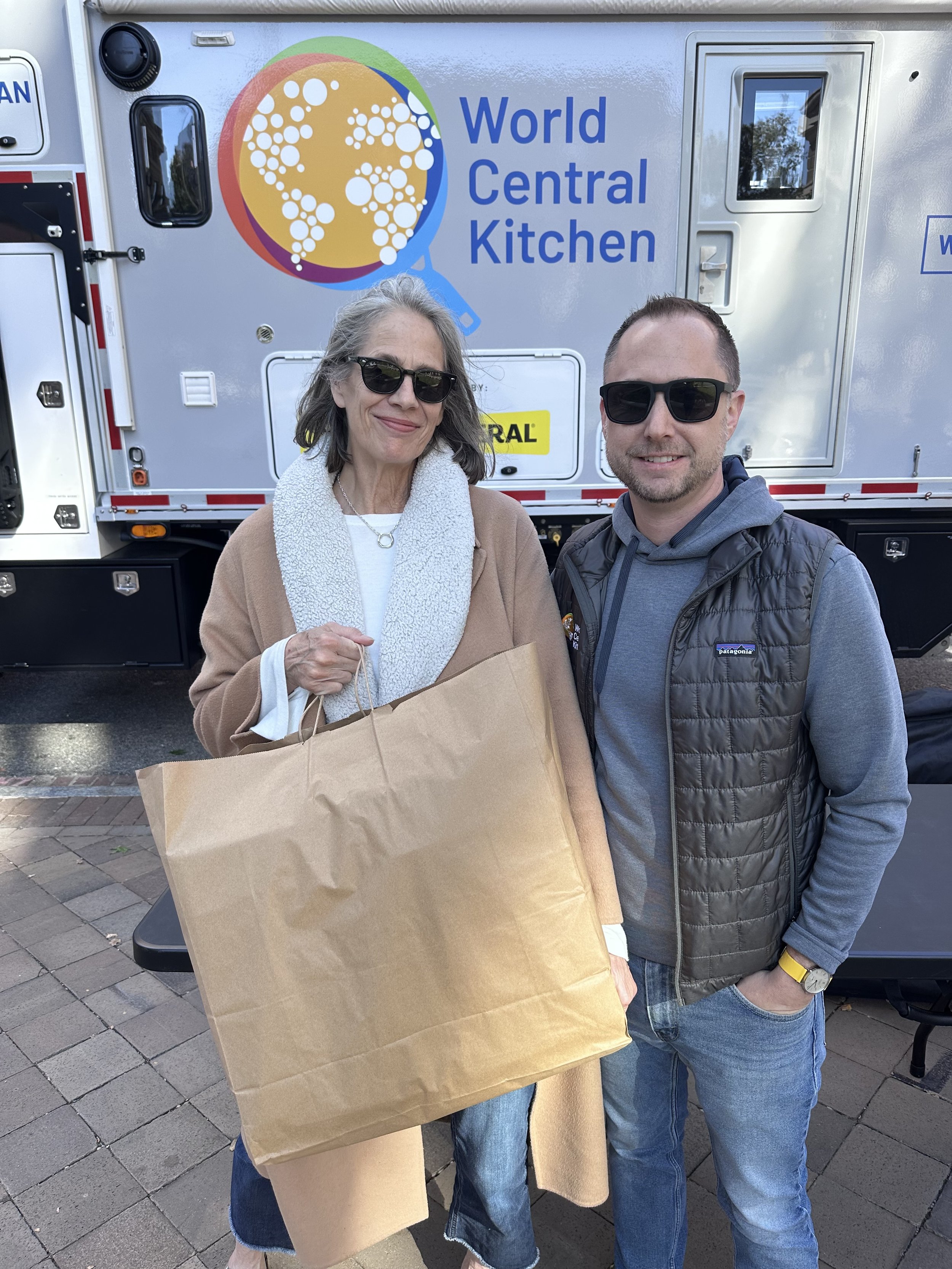 Kate Urbank, founder of DC Food Rescue (formerly Food Rescue US - DC) and Chef Matt Adler with a food donation from World Central Kitchen.