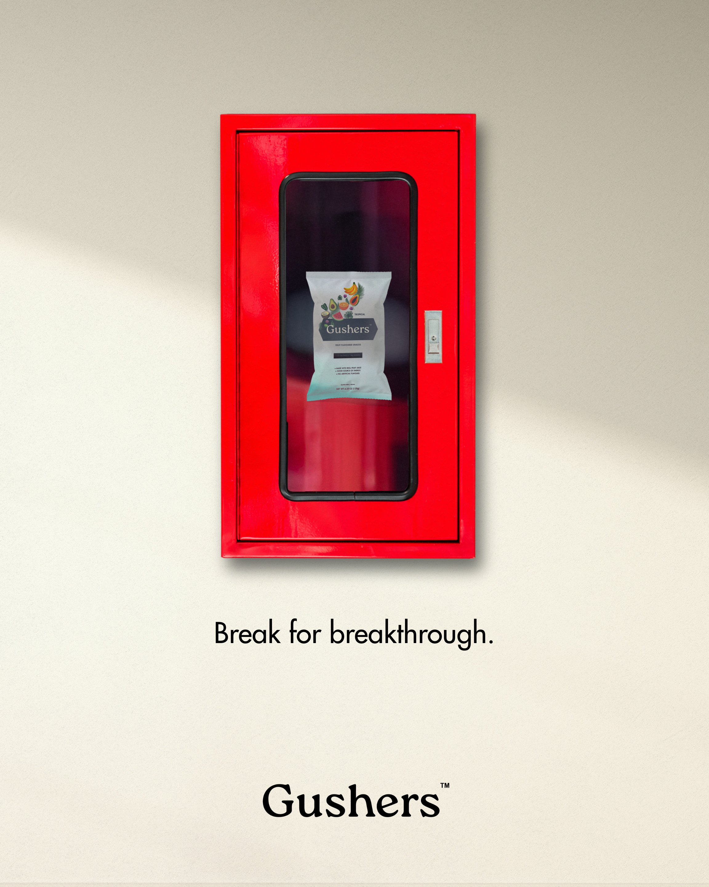 Ad featuring a fire extinguisher case filled with a pack of Gushers instead of emergency equipment.