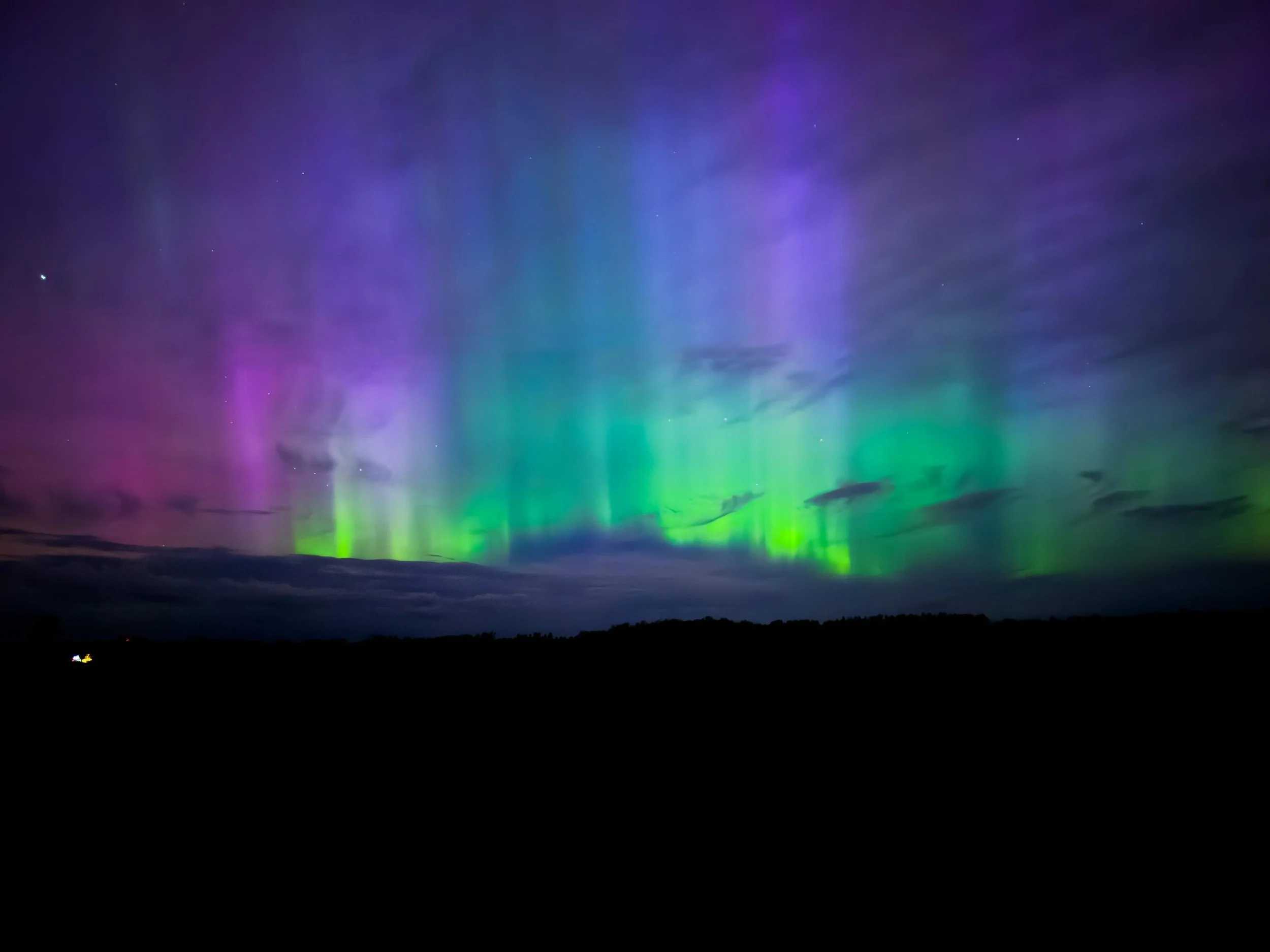 Northern lights in Michigan farm field.