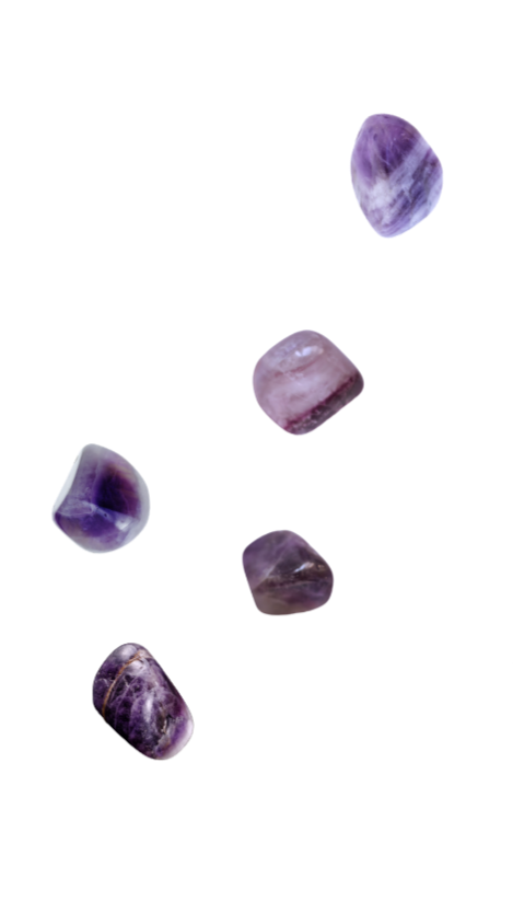 Five rough amethyst stones placed diagonally.