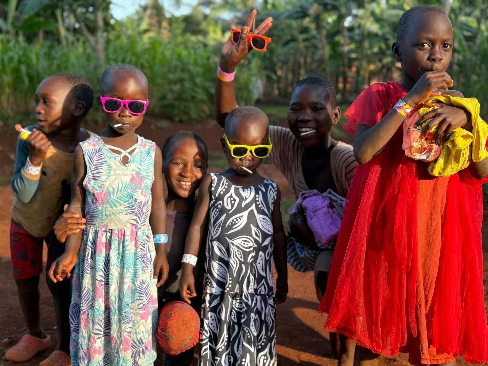 Group of youngsters wearing bright coloured sunglasses