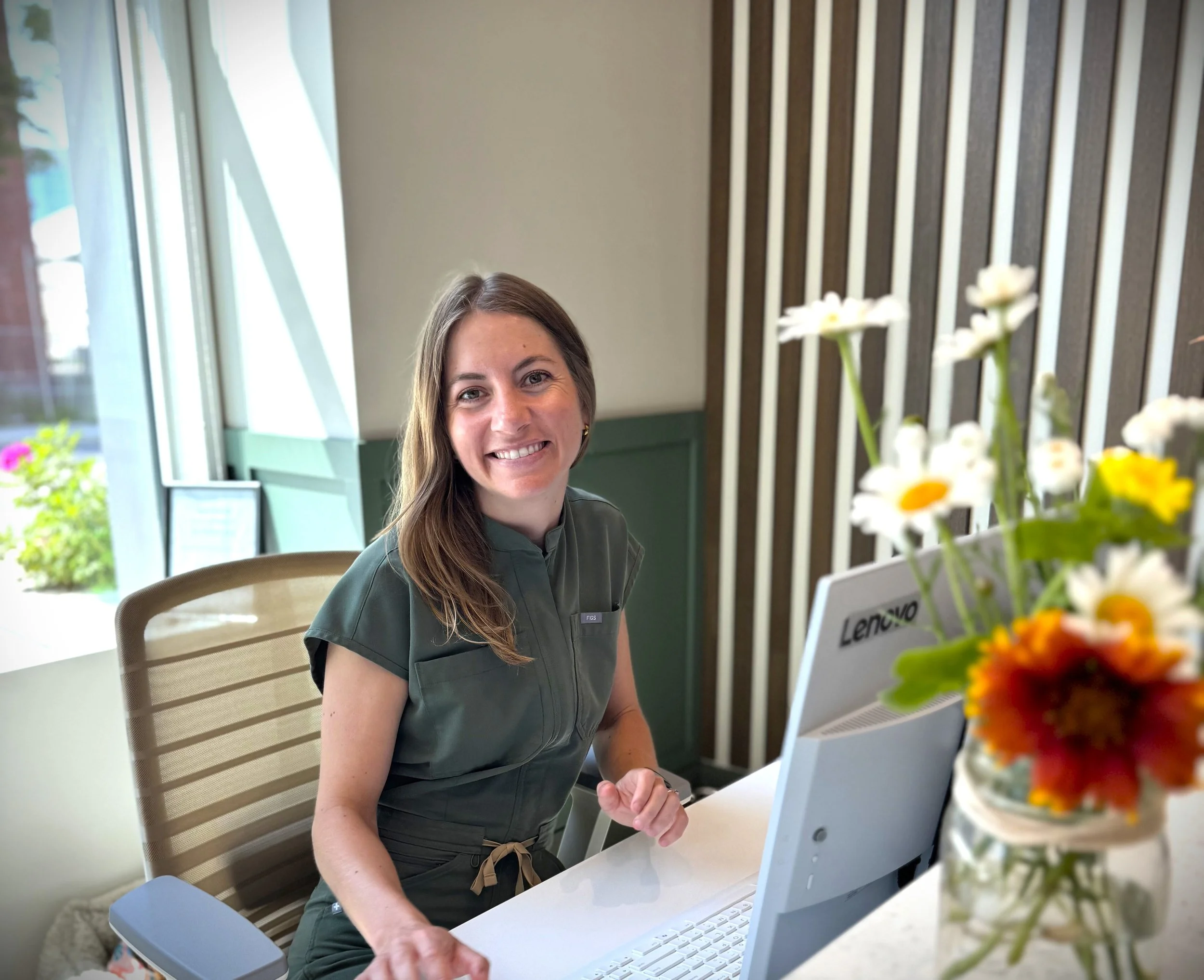 Direct billing to insurance dentist near me in Ottawa: the Tooth & Co. front desk in Centretown West handling an insurance claim.